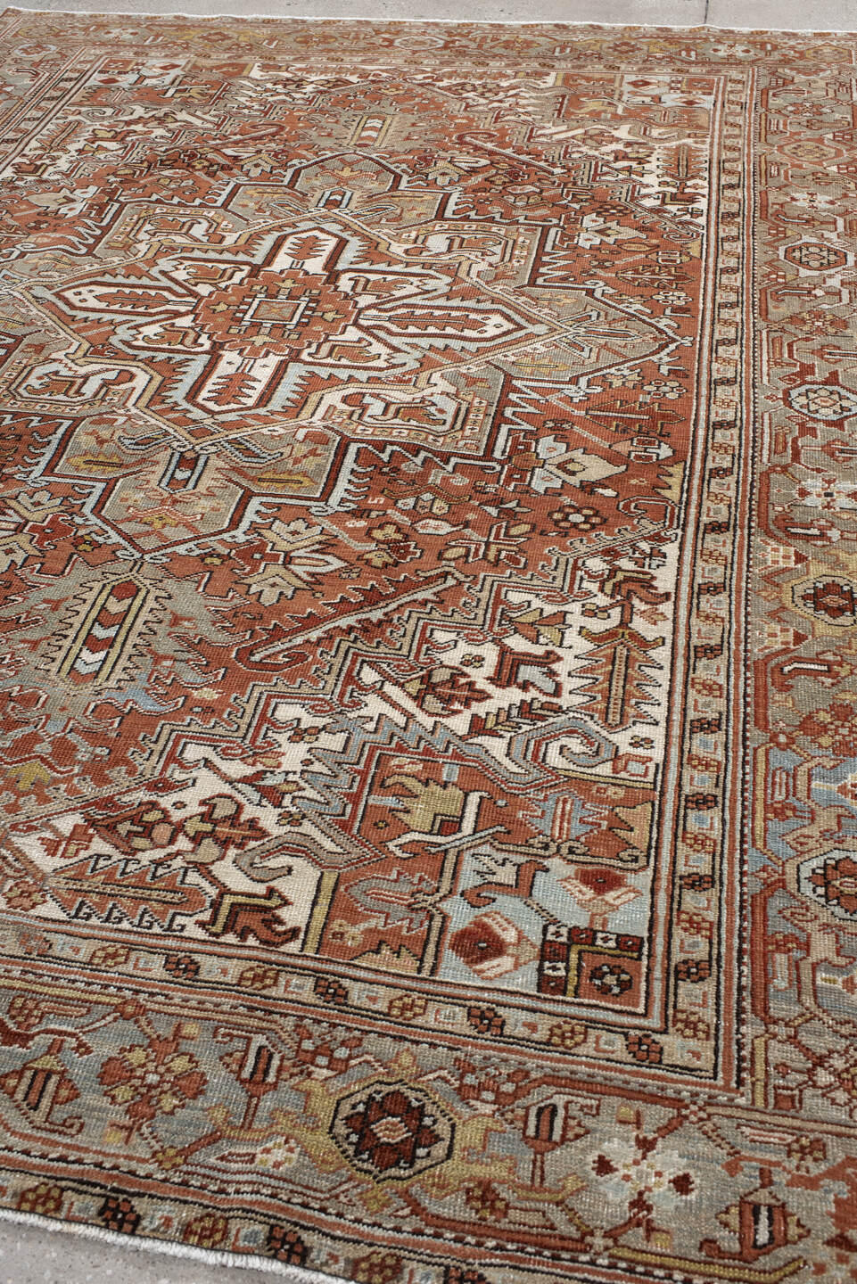 8' x 10' one-of-a-kind handmade antique Heriz large size rug. Color palette: terra cotta, blue-gray, ivory, taupe, rust