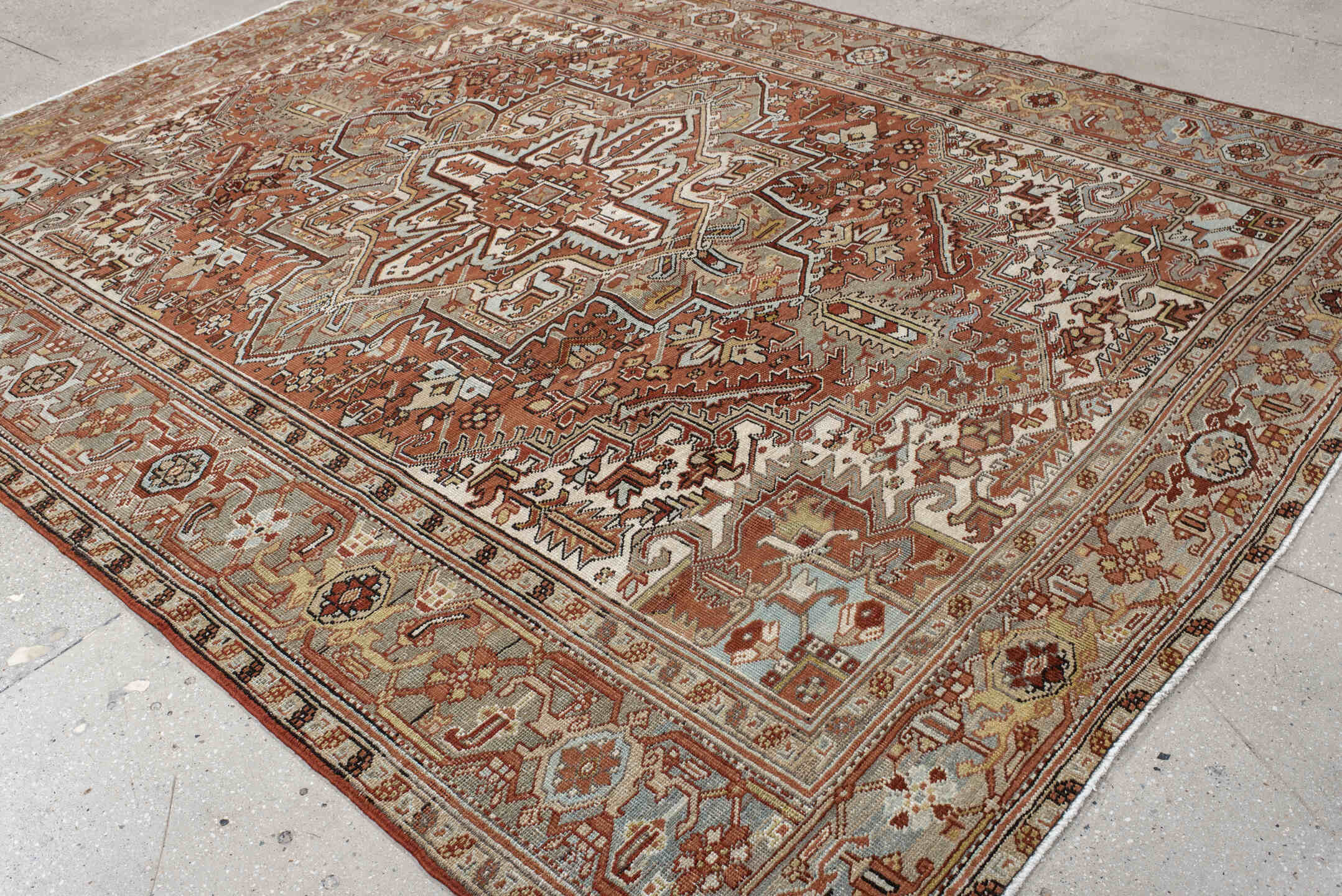 8' x 10' one-of-a-kind handmade antique Heriz large size rug. Color palette: terra cotta, blue-gray, ivory, taupe, rust