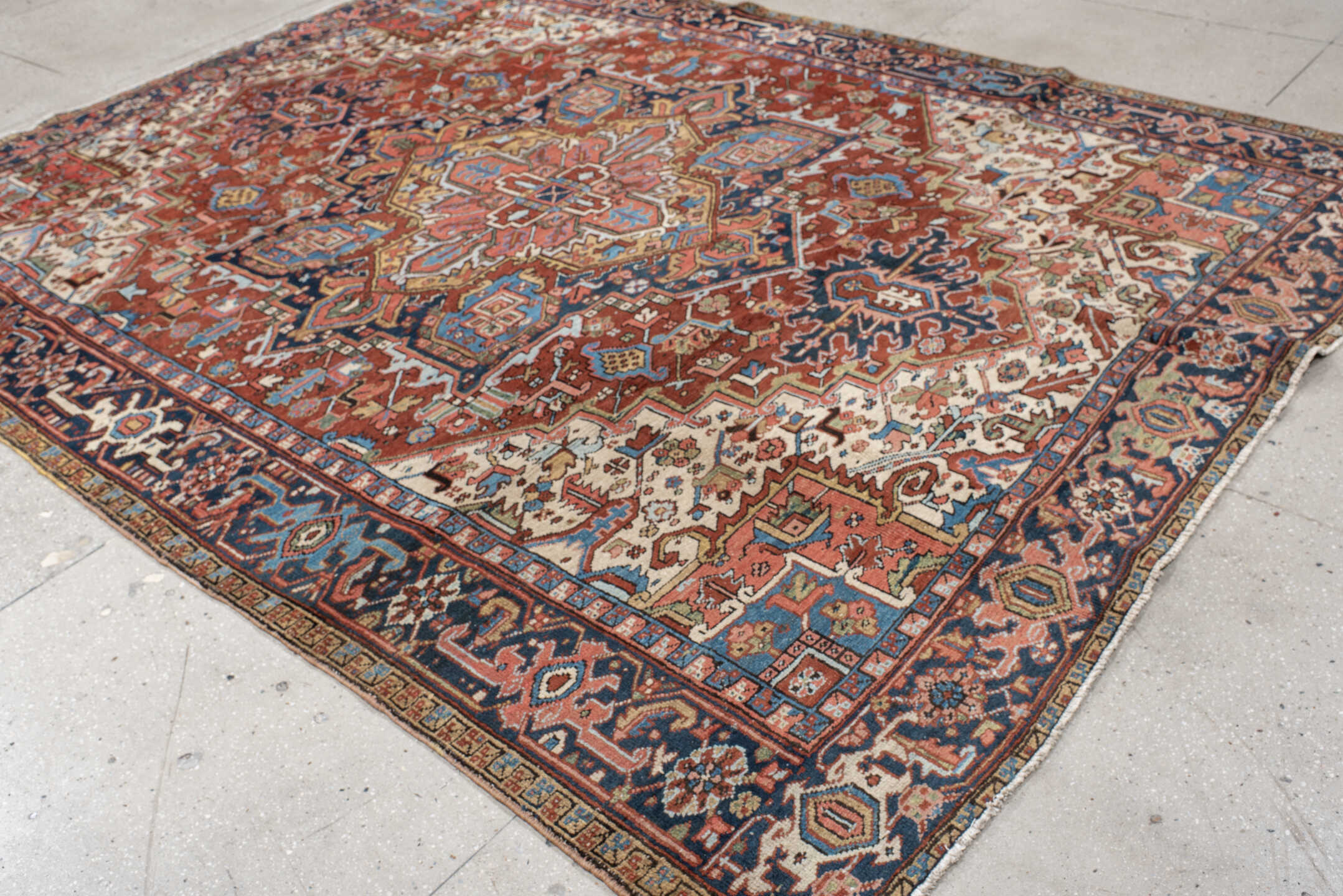 8' x 10' one-of-a-kind handmade antique Heriz large size rug. Color palette: rust, navy, ivory, sky blue, camel, coral, sage