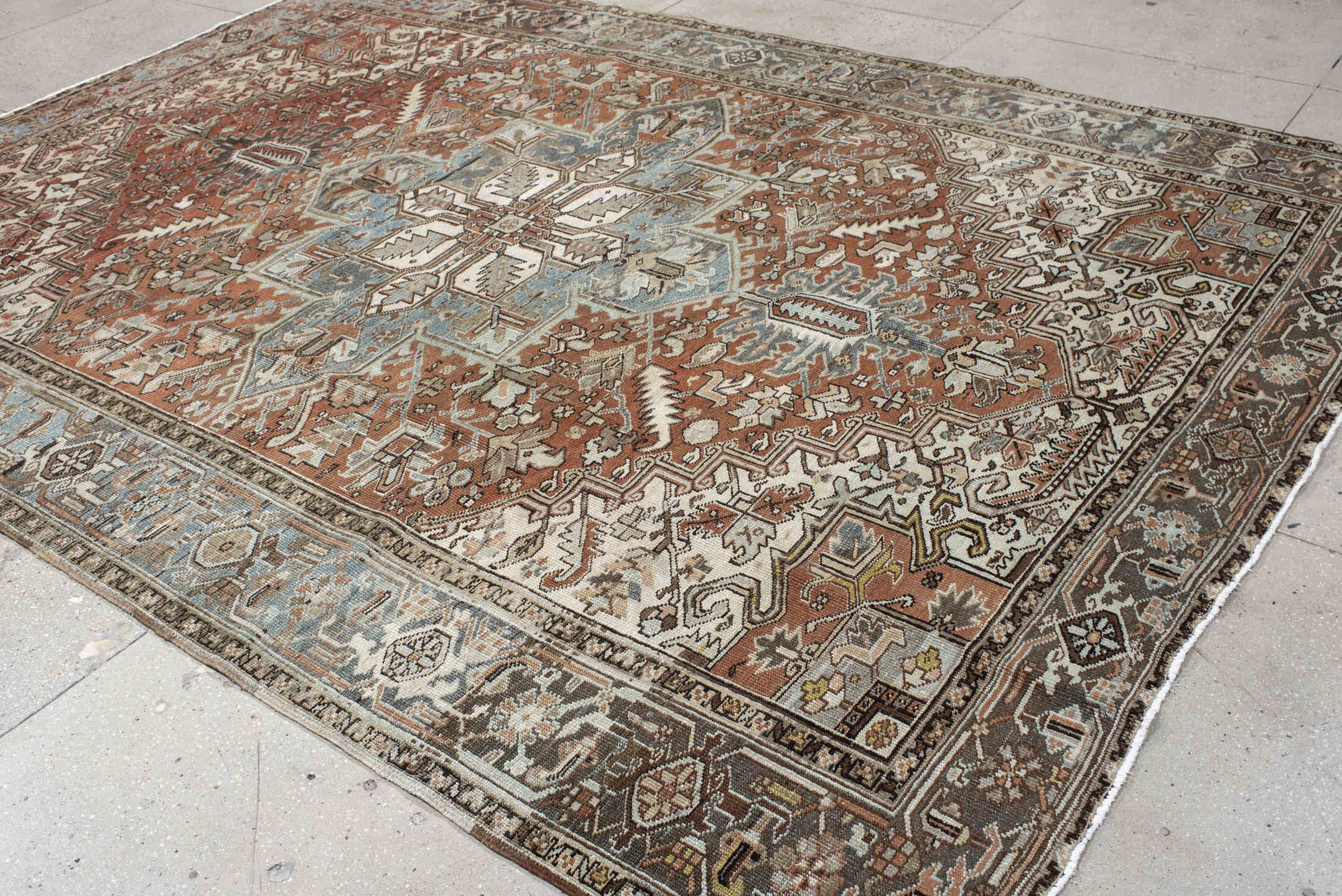 9' x 12' one-of-a-kind handmade vintage Heriz large size rug. Color palette: terra cotta, sky blue, ivory, charcoal, taupe