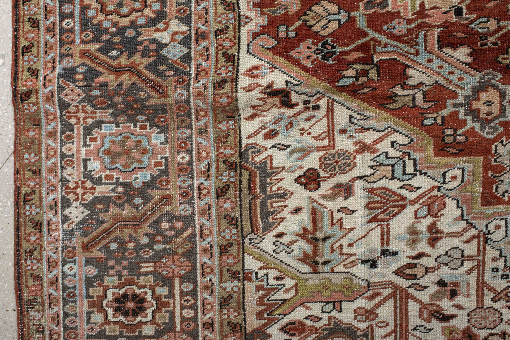 9' x 12' one-of-a-kind handmade antique Heriz large size rug. Color palette: rust, ivory, navy, terra cotta, sage, camel