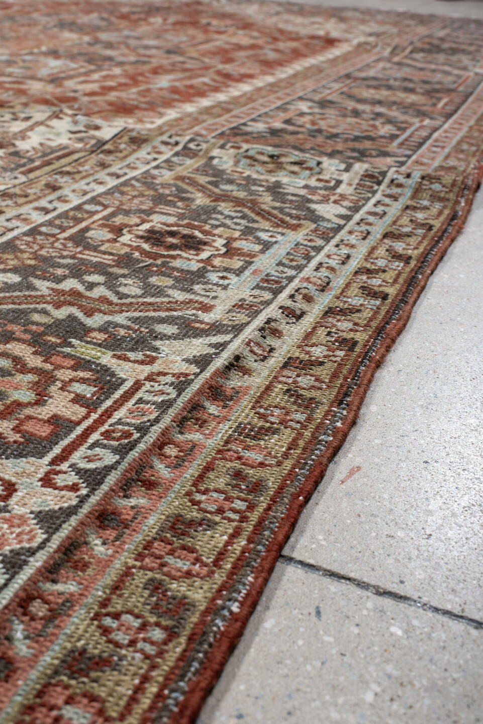 9' x 12' one-of-a-kind handmade antique Heriz large size rug. Color palette: rust, ivory, navy, terra cotta, sage, camel