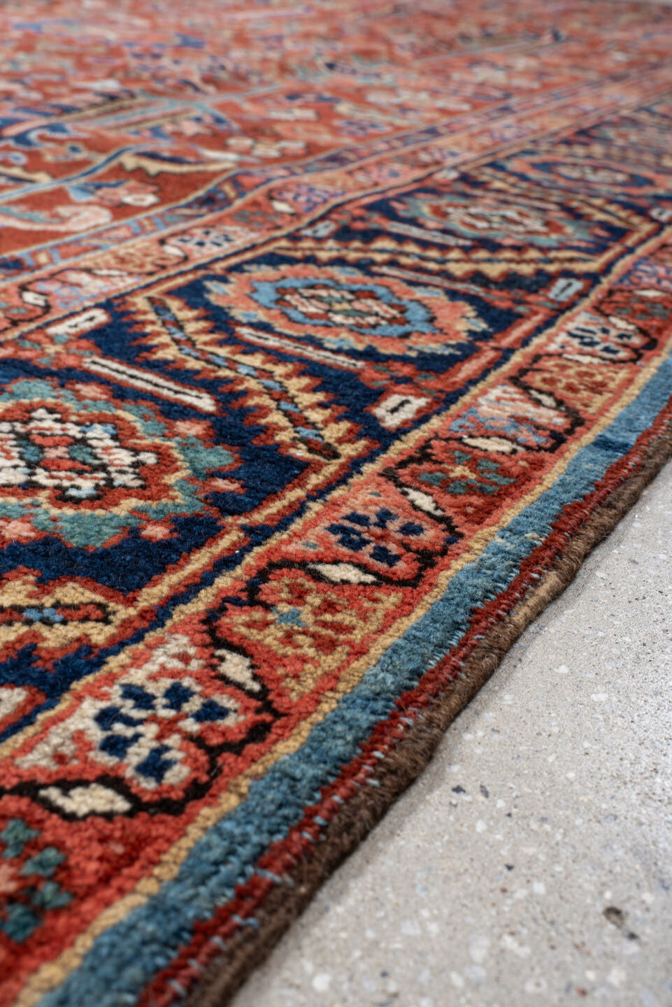 9' x 12' one-of-a-kind handmade antique Heriz large size rug. Color palette: rust, navy, ivory, sky_blue, coral, sage, camel