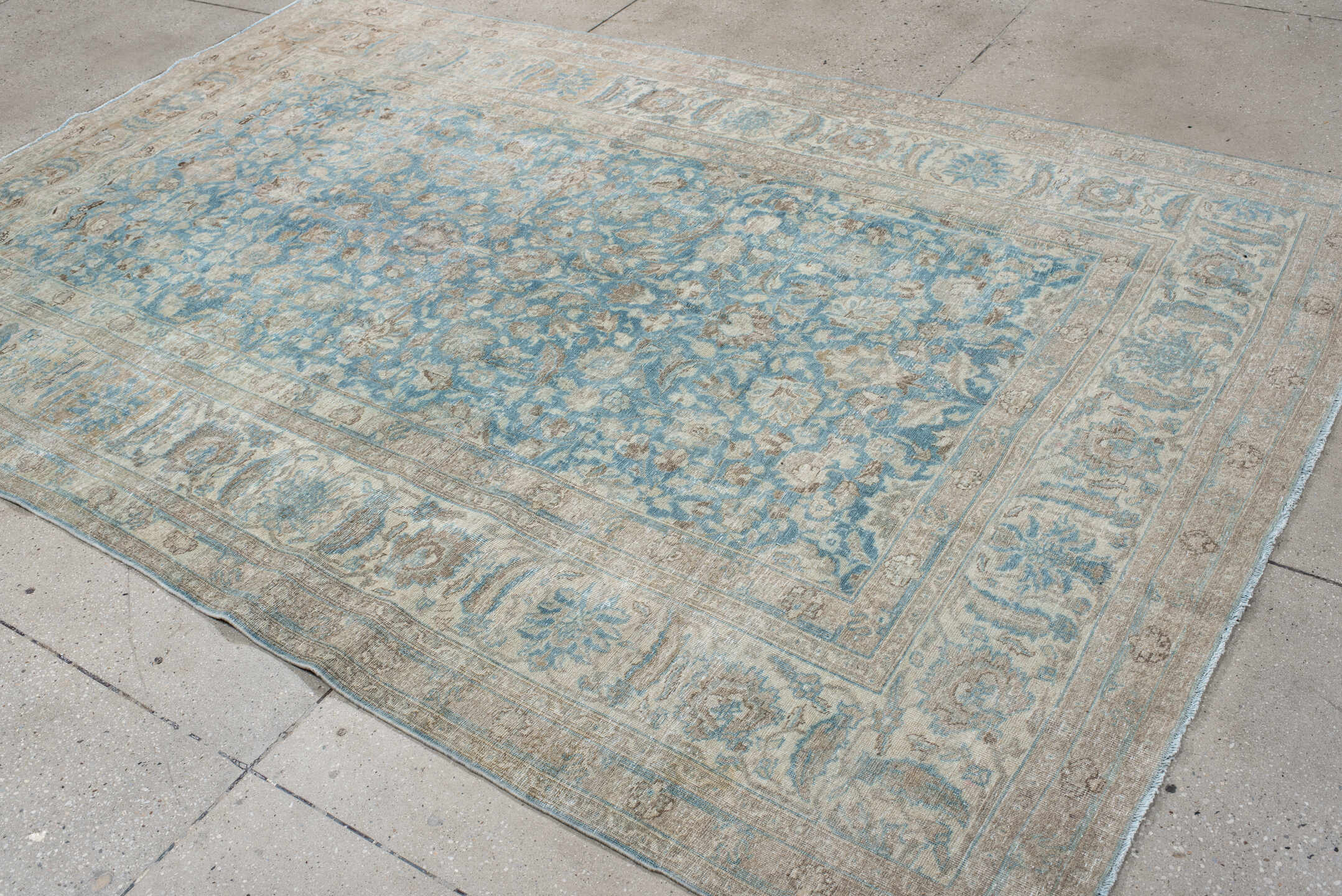 6' x 9' one-of-a-kind handmade antique Tabriz medium size rug. Color palette: ivory, sky blue, beige, taupe, camel