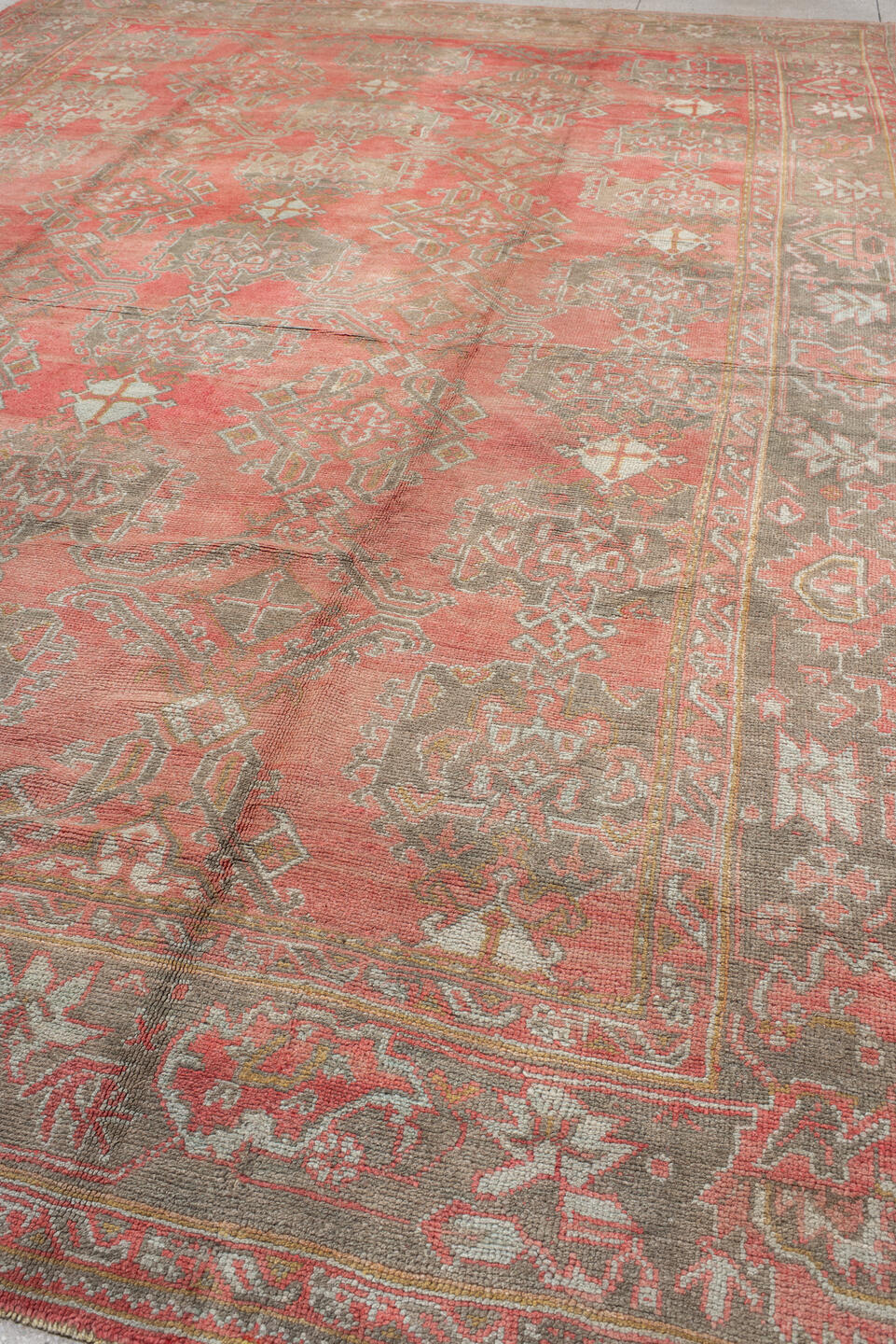 11' x 17' one-of-a-kind handmade vintage Oushak oversize rug. Color palette: coral, taupe, sage, ivory, rose, terracotta