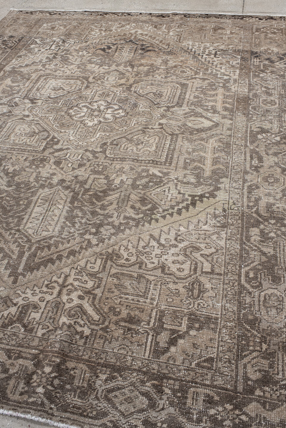 7' x 10' one-of-a-kind handmade antique Heriz large size rug. Color palette: taupe, brown, ivory, charcoal, beige, gray