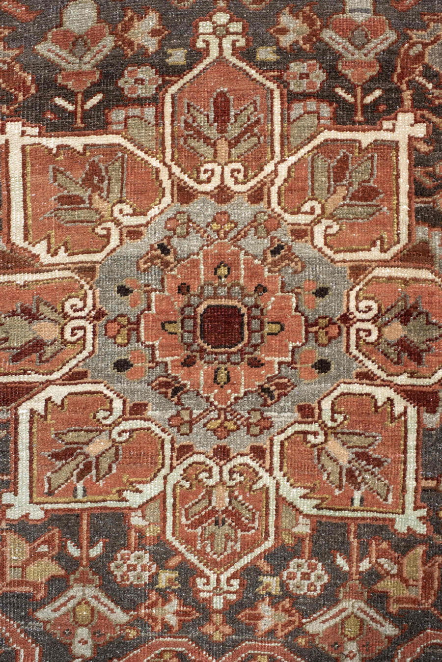 7' x 11' one-of-a-kind handmade antique Heriz large size rug. Color palette: rust, brick, slate, ivory, camel, taupe