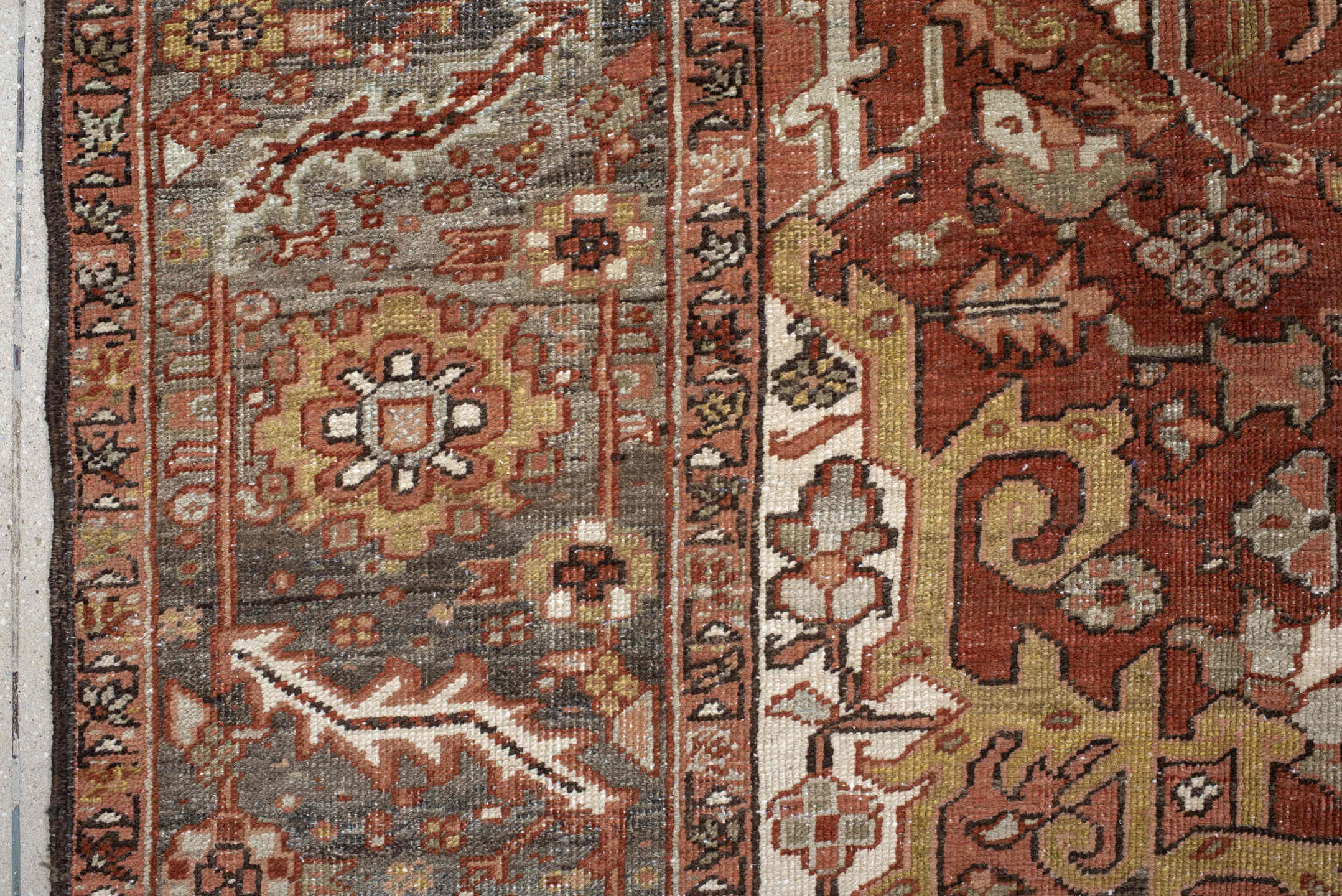 7' x 11' one-of-a-kind handmade antique Heriz large size rug. Color palette: rust, brick, slate, ivory, camel, taupe