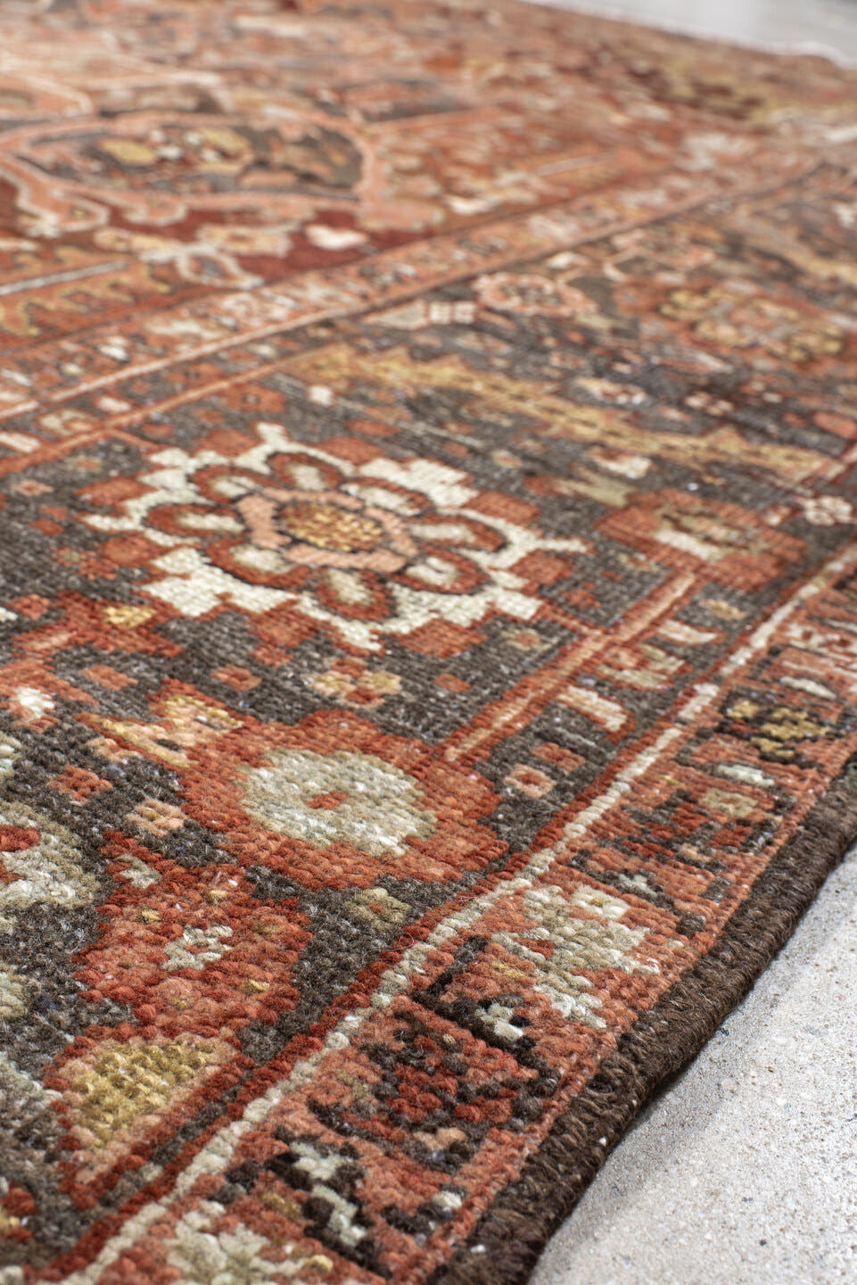 7' x 11' one-of-a-kind handmade antique Heriz large size rug. Color palette: rust, brick, slate, ivory, camel, taupe