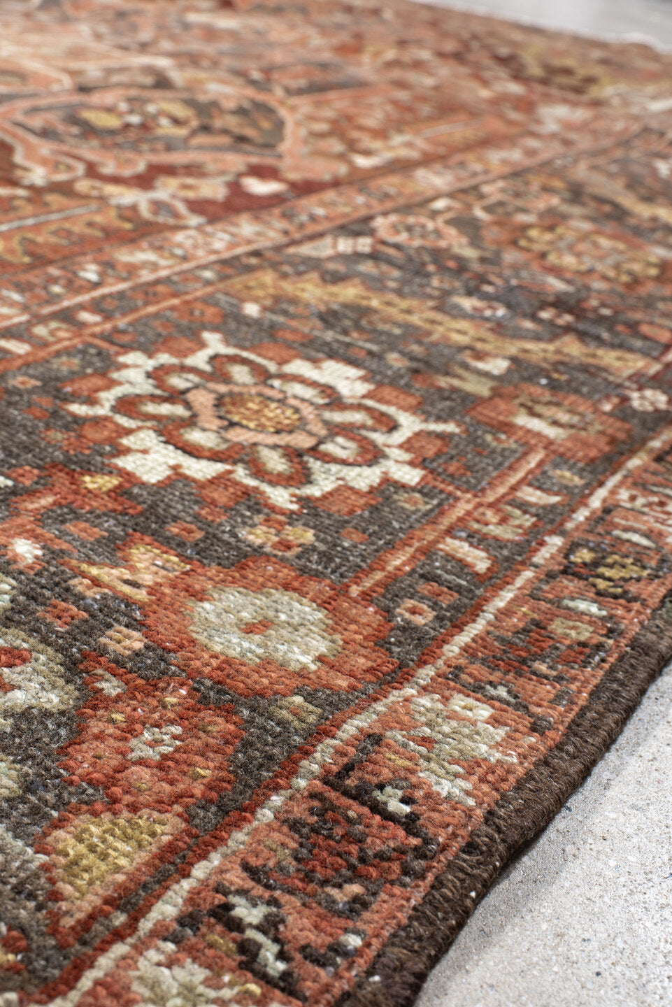 7' x 11' one-of-a-kind handmade antique Heriz large size rug. Color palette: rust, brick, slate, ivory, camel, taupe