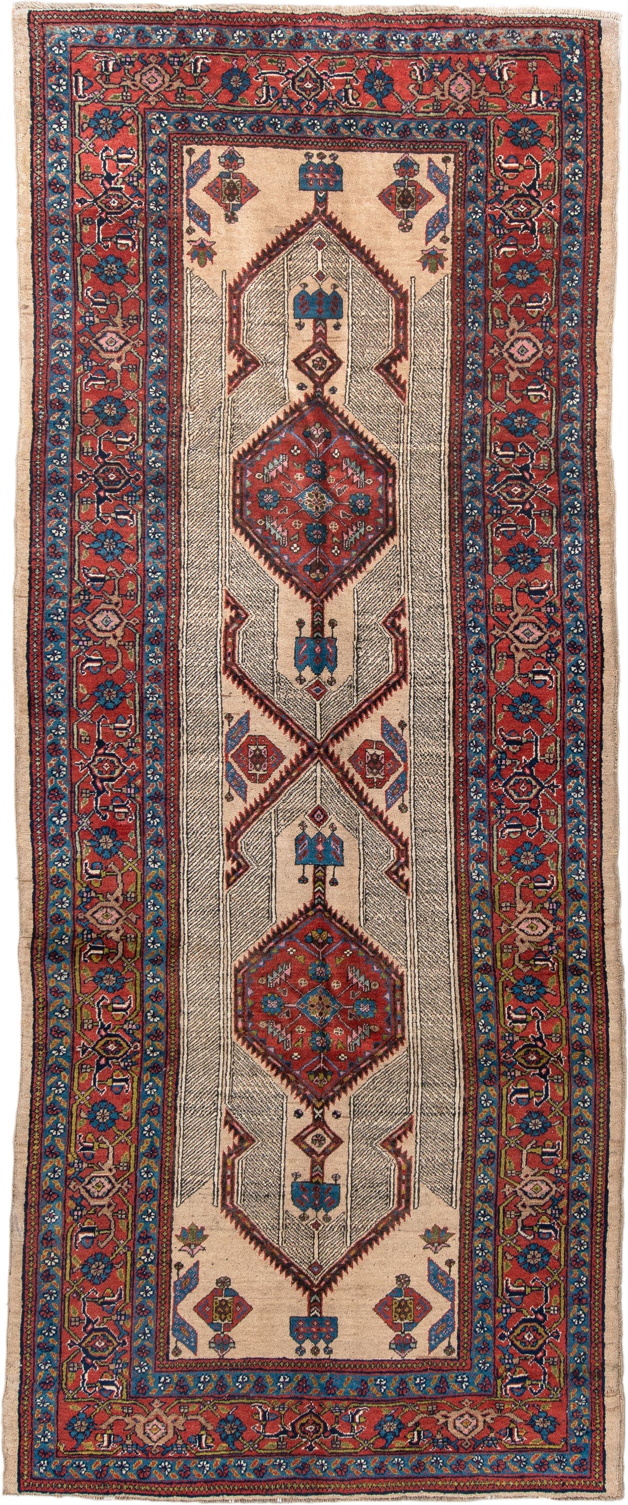 4' x 11' one-of-a-kind handmade antique Sarab runner rug. Color palette: ivory, rust, indigo, navy, crimson, camel, saffron