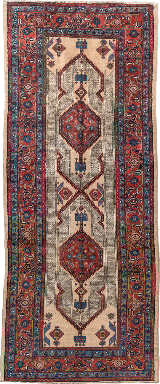 4' x 11' one-of-a-kind handmade antique Sarab runner rug. Color palette: ivory, rust, indigo, navy, crimson, camel, saffron