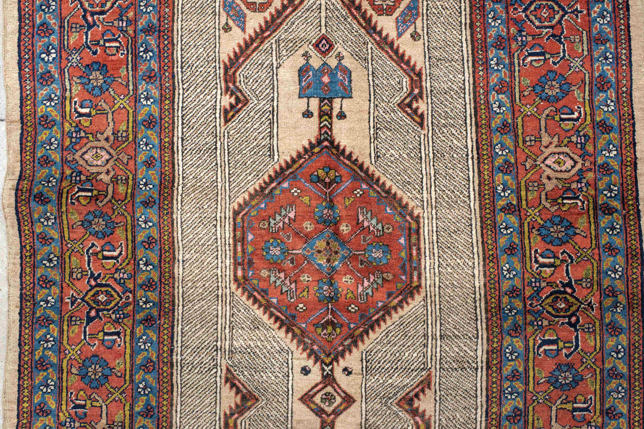 4' x 11' one-of-a-kind handmade antique Sarab runner rug. Color palette: ivory, rust, indigo, navy, crimson, camel, saffron