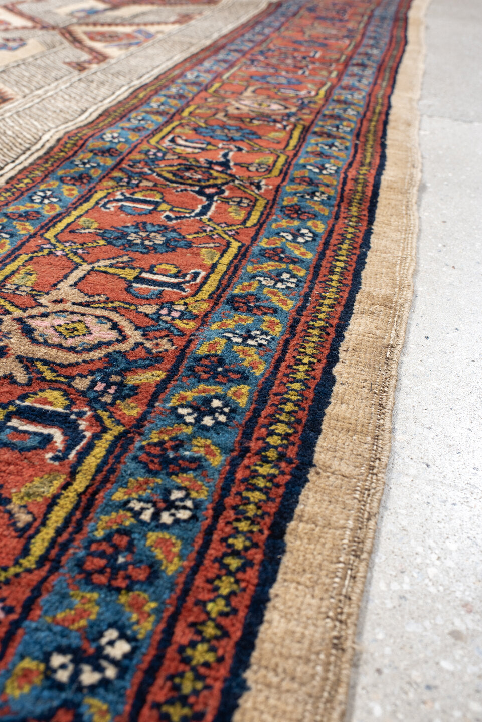 4' x 11' one-of-a-kind handmade antique Sarab runner rug. Color palette: ivory, rust, indigo, navy, crimson, camel, saffron