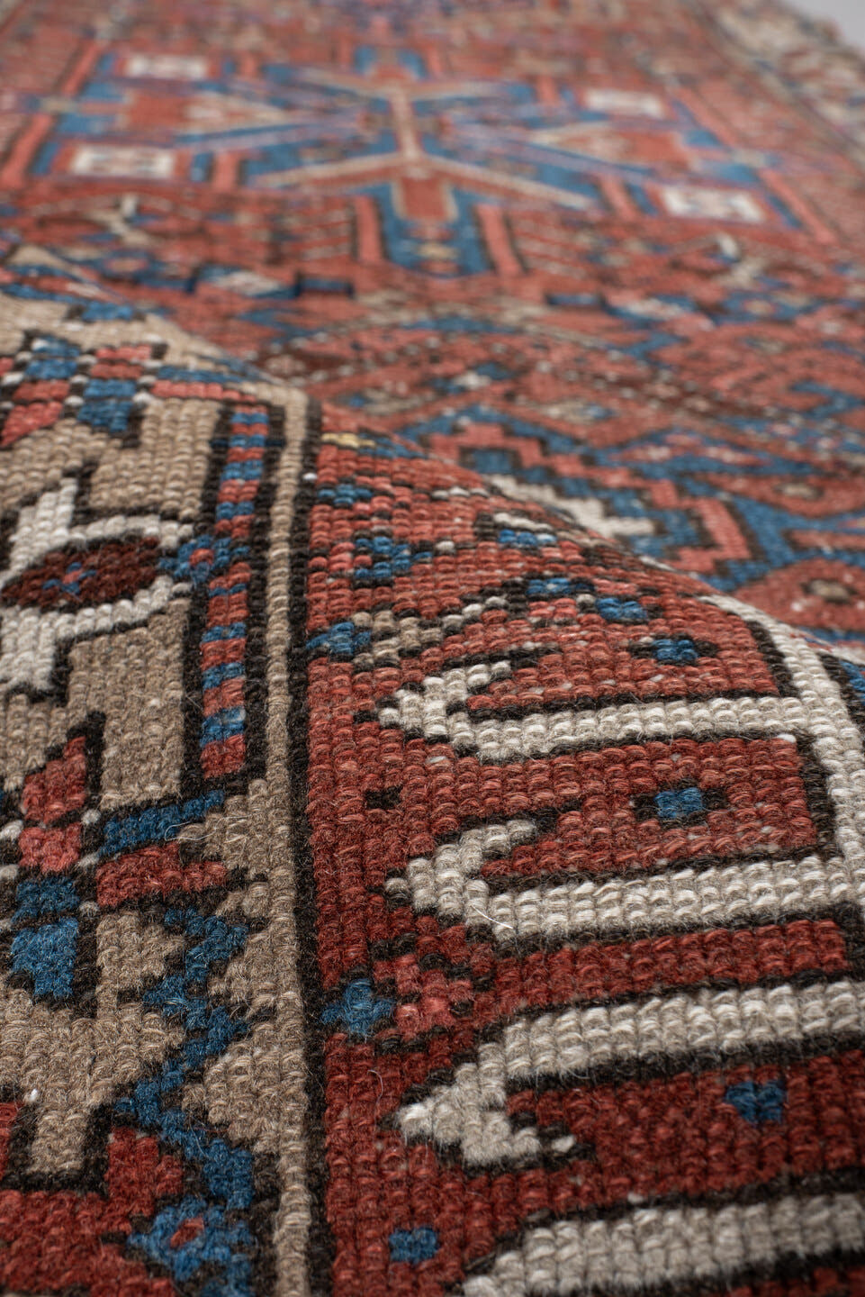 2' x 10' one-of-a-kind handmade vintage Karaje runner rug. Color palette: rust, blue, ivory, navy, taupe, camel, charcoal