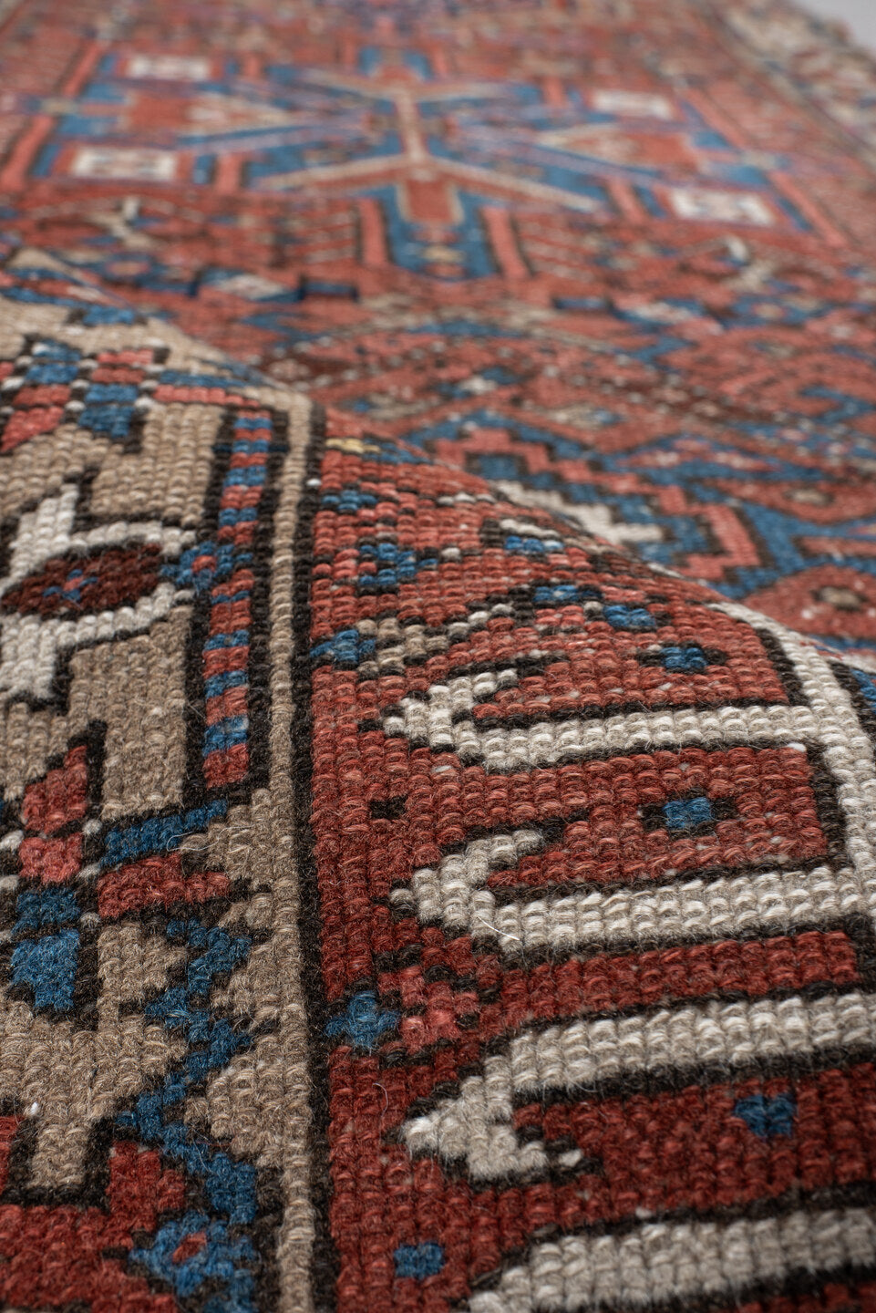 2' x 10' one-of-a-kind handmade vintage Karaje runner rug. Color palette: rust, blue, ivory, navy, taupe, camel, charcoal