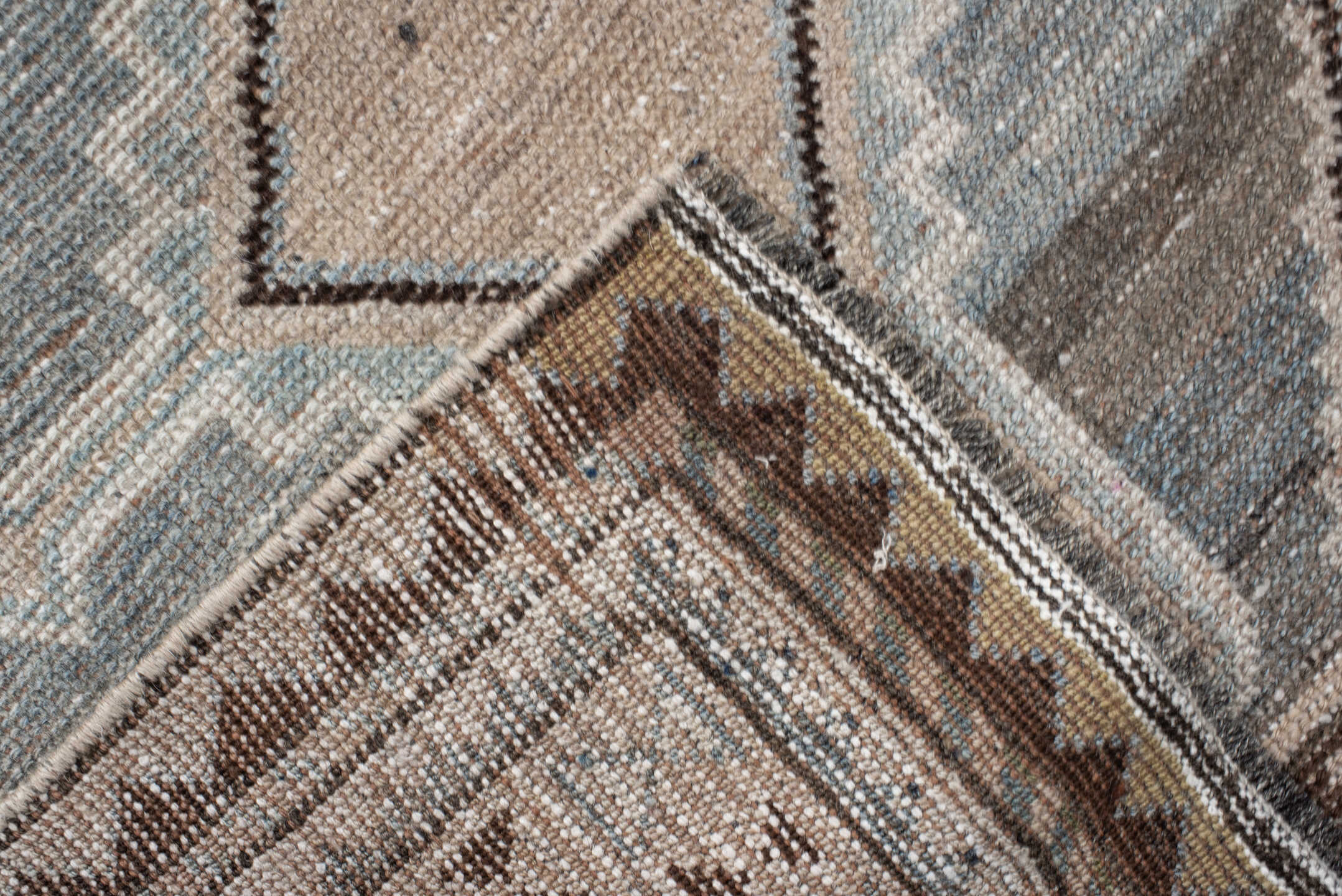 4' x 8' one-of-a-kind handmade vintage Gabbe rug. Color palette: ivory, blue, charcoal, taupe, brown, camel, gray, black