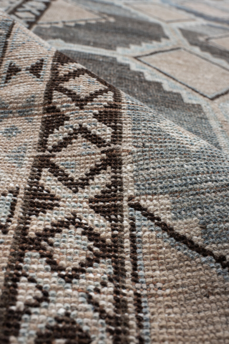 4' x 8' one-of-a-kind handmade vintage Gabbe rug. Color palette: ivory, blue, charcoal, taupe, brown, camel, gray, black