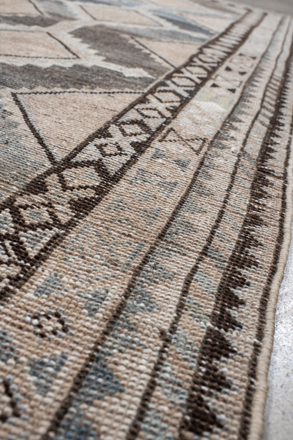 4' x 8' one-of-a-kind handmade vintage Gabbe rug. Color palette: ivory, blue, charcoal, taupe, brown, camel, gray, black