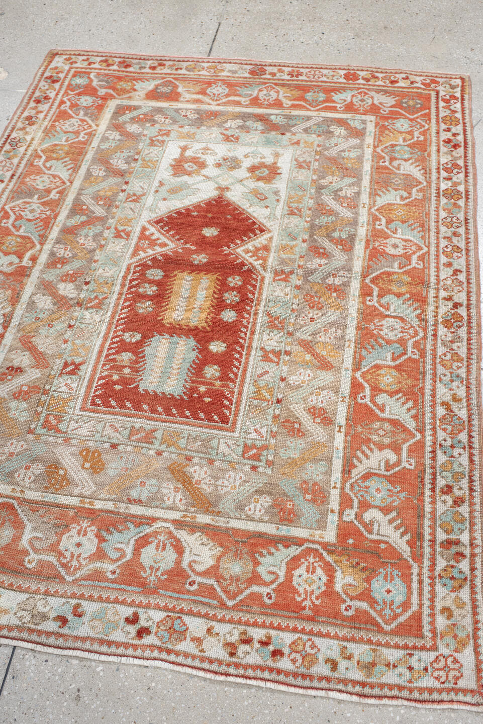 4' x 5' one-of-a-kind handmade vintage Anatolian small size rug. Color palette: terra cotta, ivory, pale aqua, sand, rust