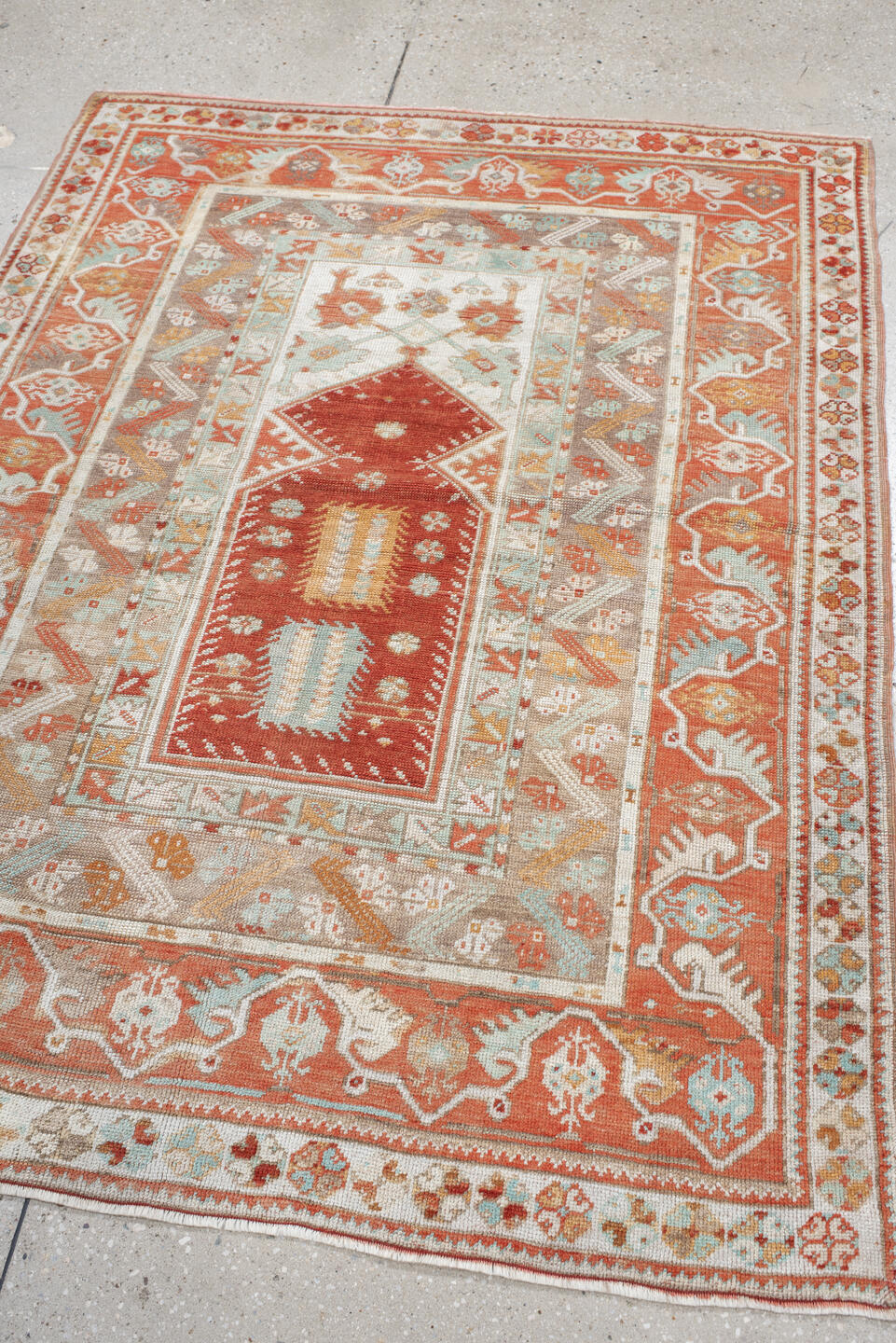4' x 5' one-of-a-kind handmade vintage Anatolian small size rug. Color palette: terra cotta, ivory, pale aqua, sand, rust