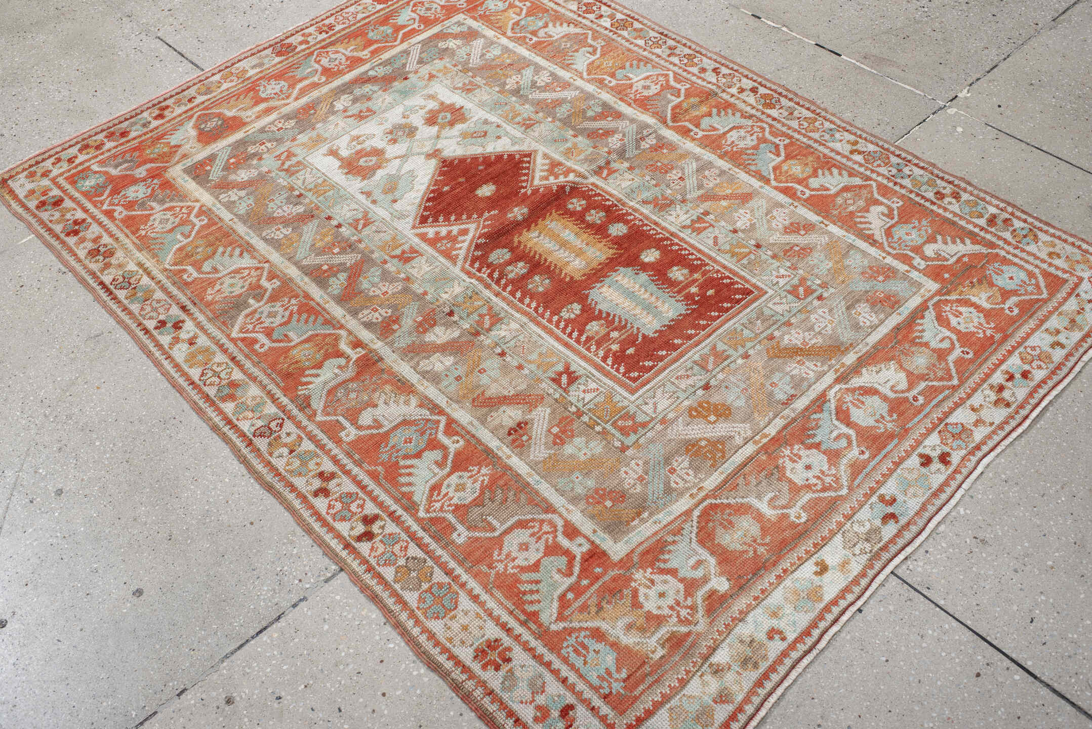 4' x 5' one-of-a-kind handmade vintage Anatolian small size rug. Color palette: terra cotta, ivory, pale aqua, sand, rust