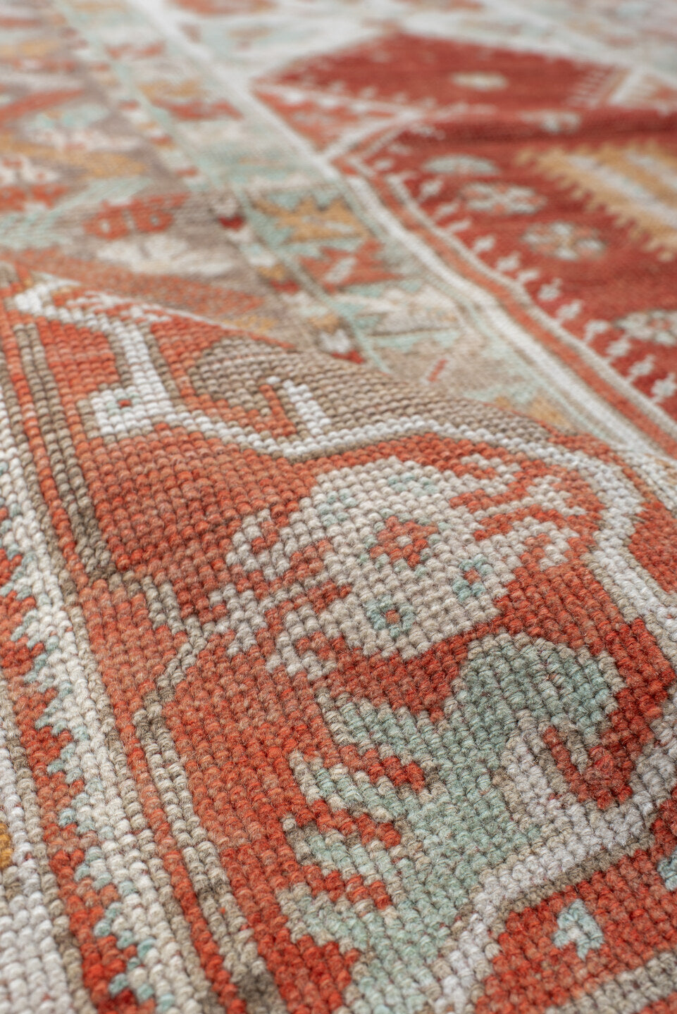 4' x 5' one-of-a-kind handmade vintage Anatolian small size rug. Color palette: terra cotta, ivory, pale aqua, sand, rust