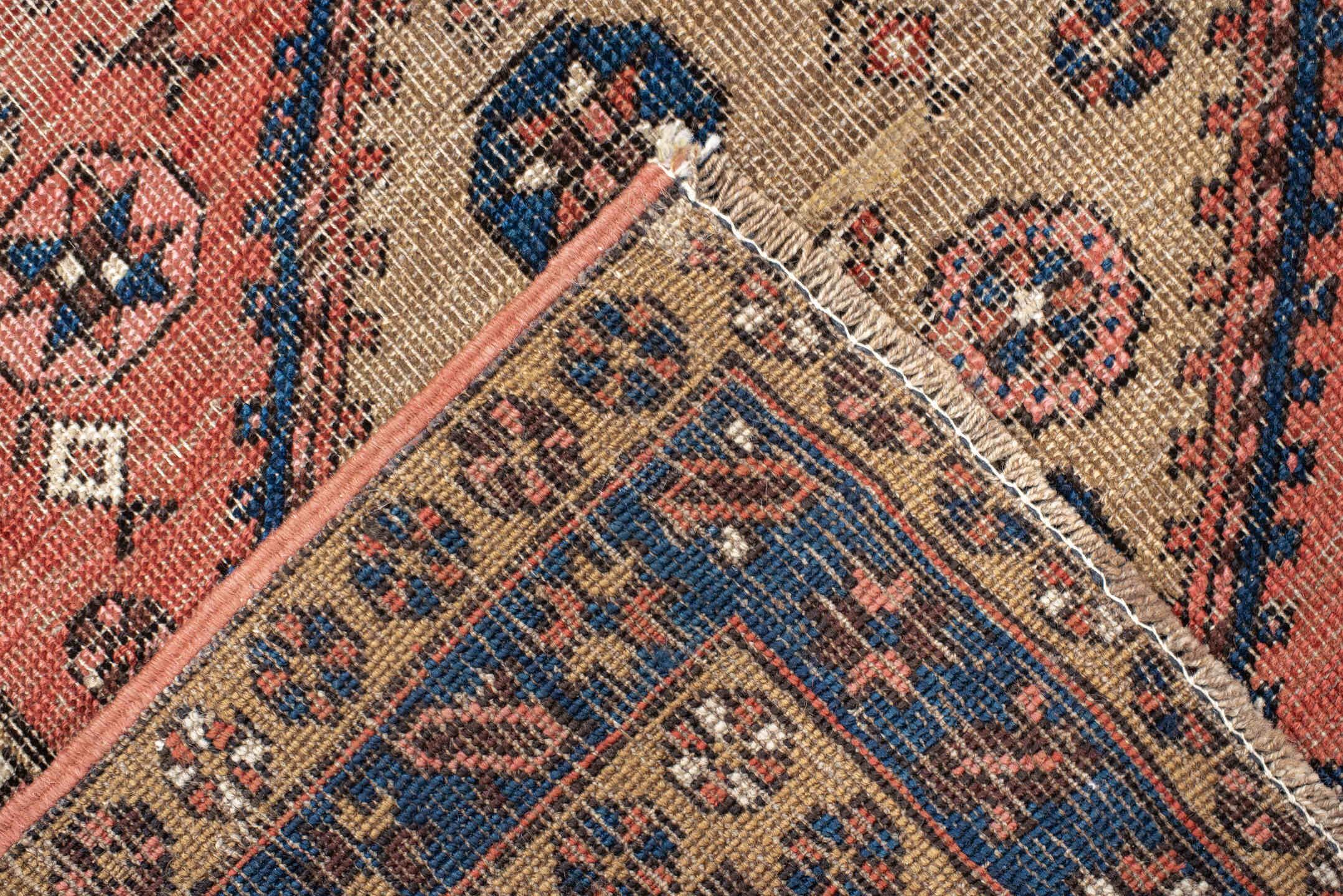 3' x 6' one-of-a-kind handmade antique  runner rug. Color palette: rose, indigo, ivory, rust, navy, camel, crimson, pink