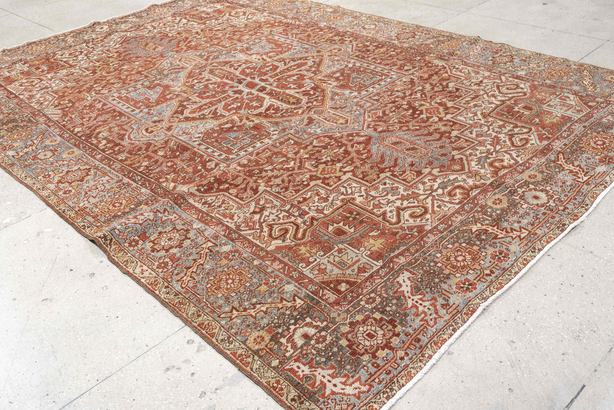 8' x 11' one-of-a-kind handmade vintage Heriz large size rug. Color palette: terracotta, sky blue, ivory, rust, taupe, camel