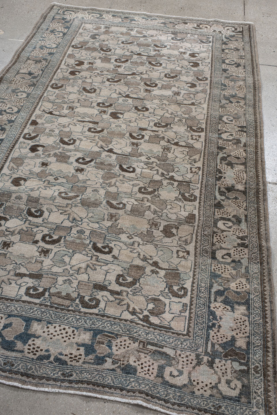 4' x 8' one-of-a-kind handmade vintage Bidjar rug. Color palette: ivory, pale blue, taupe, brown, gray, beige, light blue