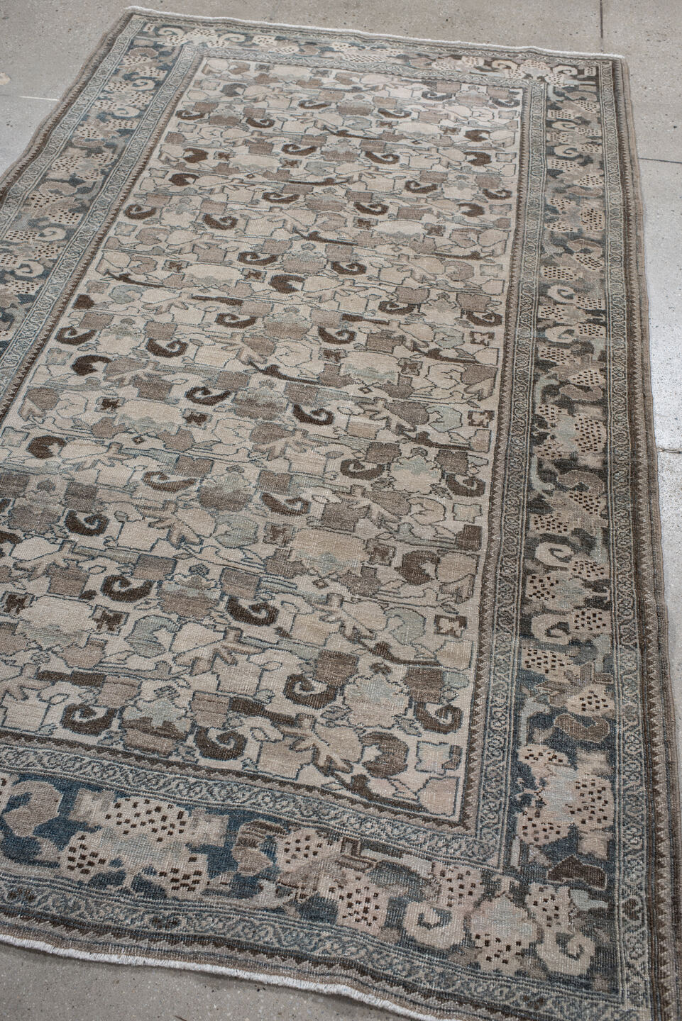 4' x 8' one-of-a-kind handmade vintage Bidjar rug. Color palette: ivory, pale blue, taupe, brown, gray, beige, light blue
