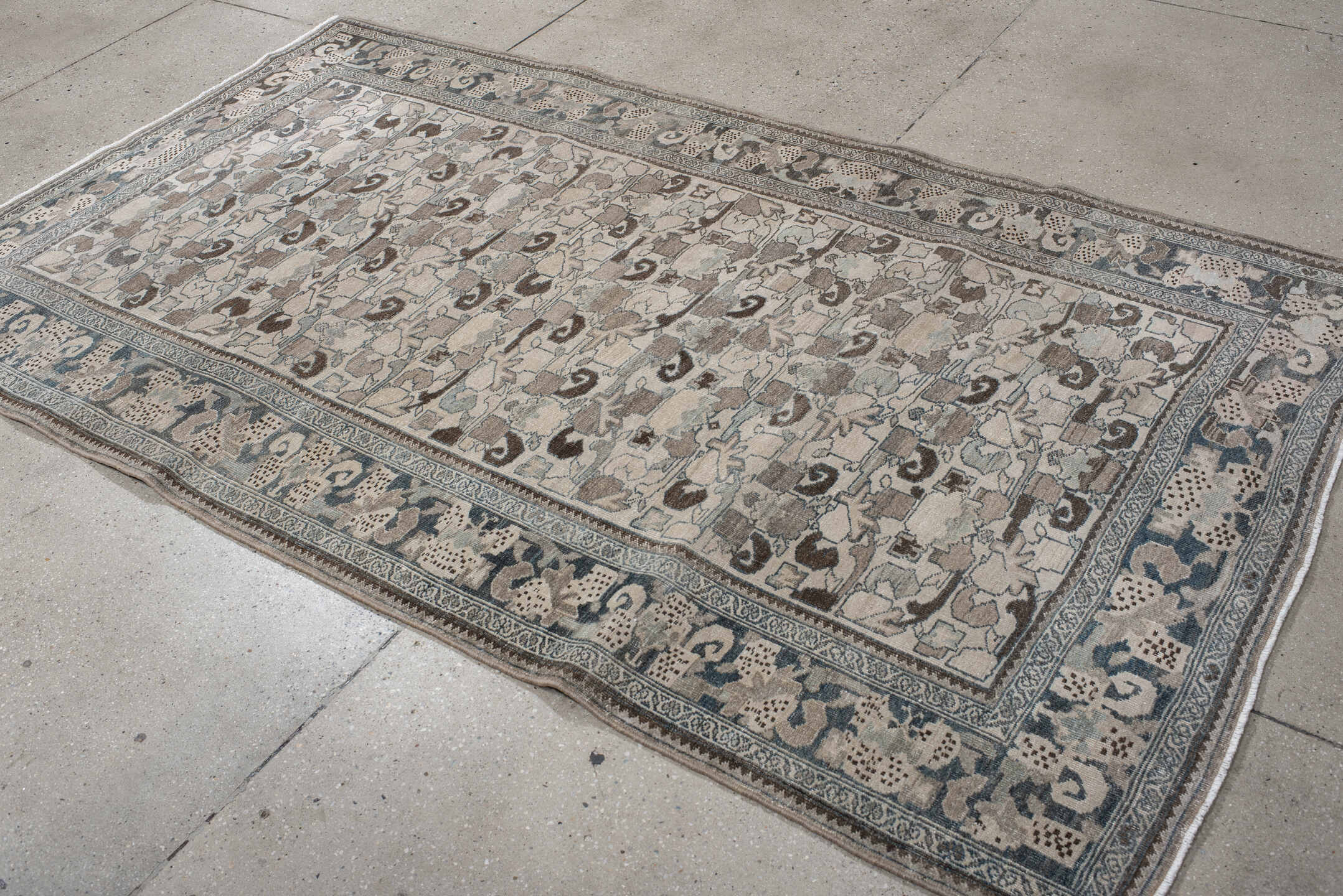 4' x 8' one-of-a-kind handmade vintage Bidjar rug. Color palette: ivory, pale blue, taupe, brown, gray, beige, light blue