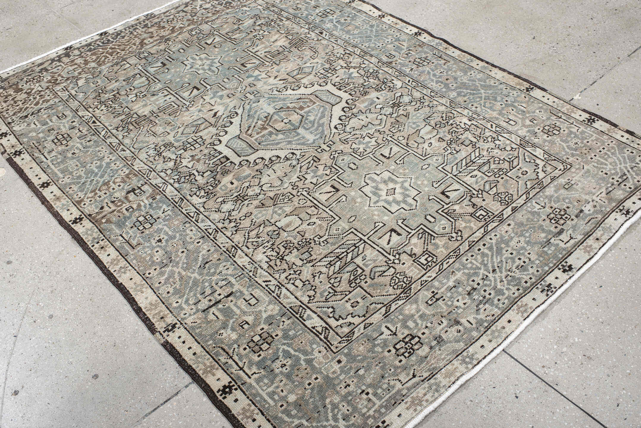 5' x 6' one-of-a-kind handmade vintage Karaje rug. Color palette: ivory, pale blue, taupe, charcoal, beige, slate
