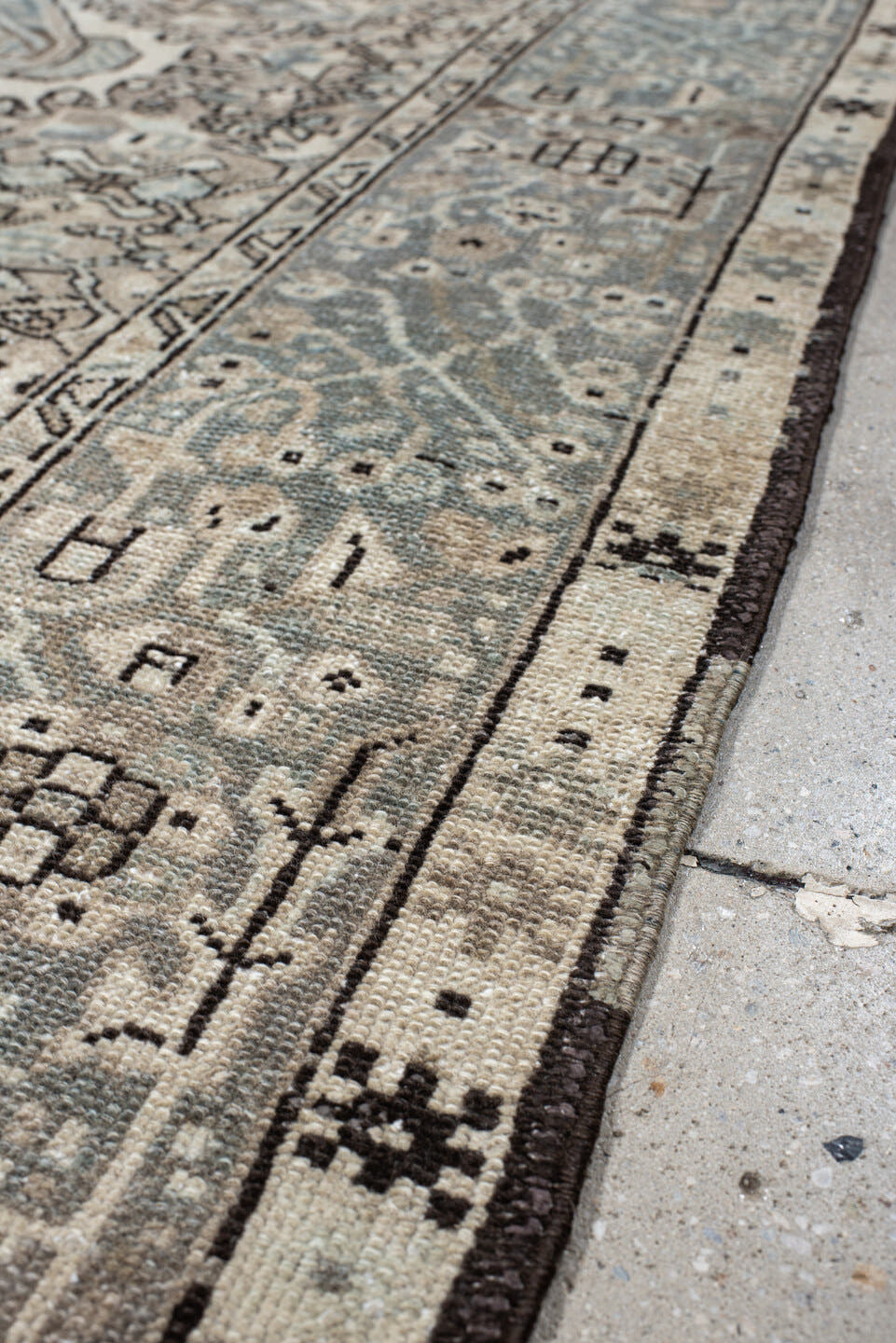 5' x 6' one-of-a-kind handmade vintage Karaje rug. Color palette: ivory, pale blue, taupe, charcoal, beige, slate