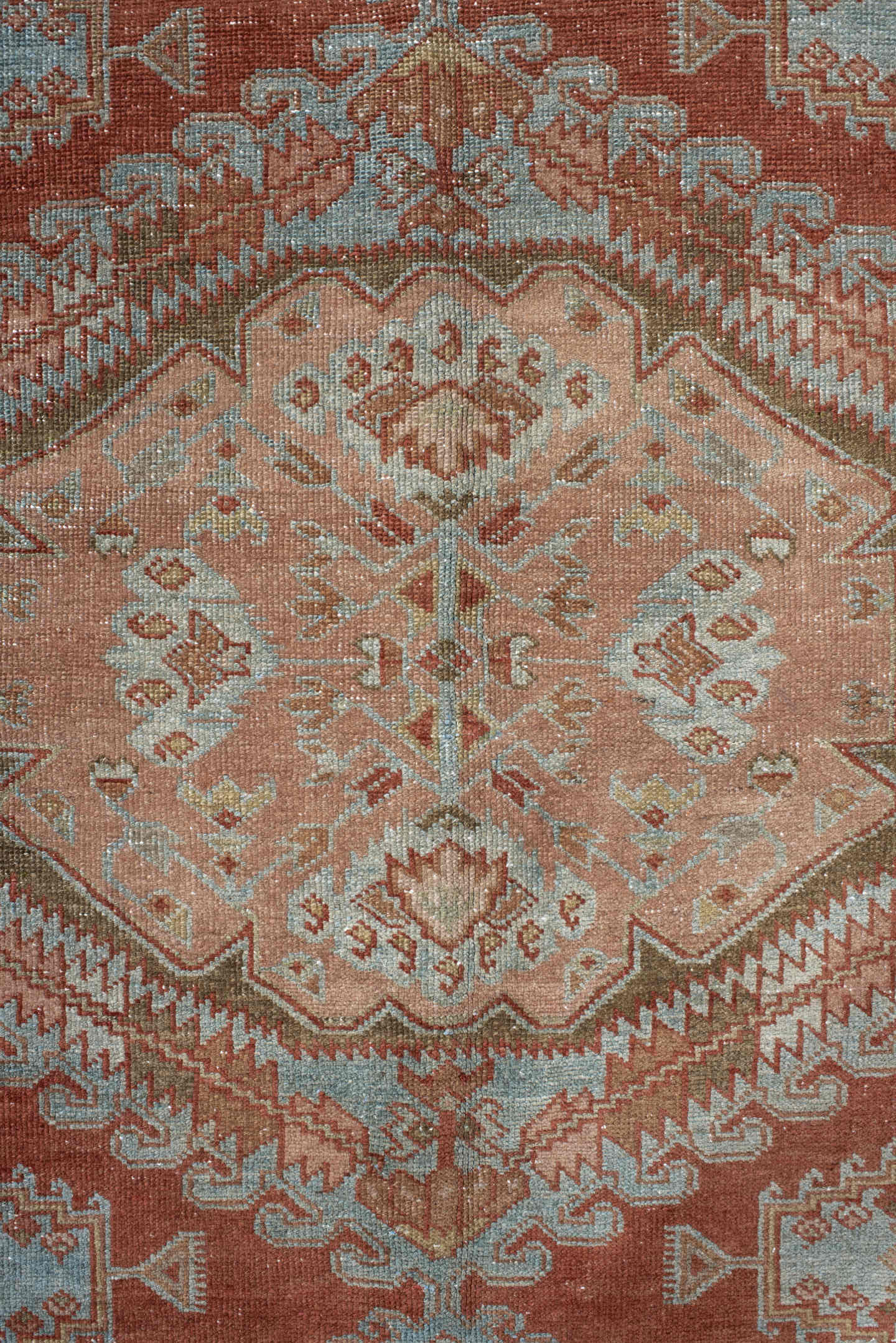 5' x 6' one-of-a-kind handmade vintage Veece rug. Color palette: terra cotta, pale blue, sage, ivory, rose, olive