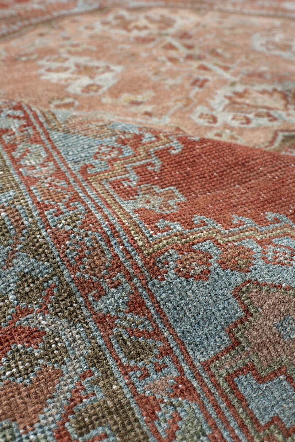 5' x 6' one-of-a-kind handmade vintage Veece rug. Color palette: terra cotta, pale blue, sage, ivory, rose, olive