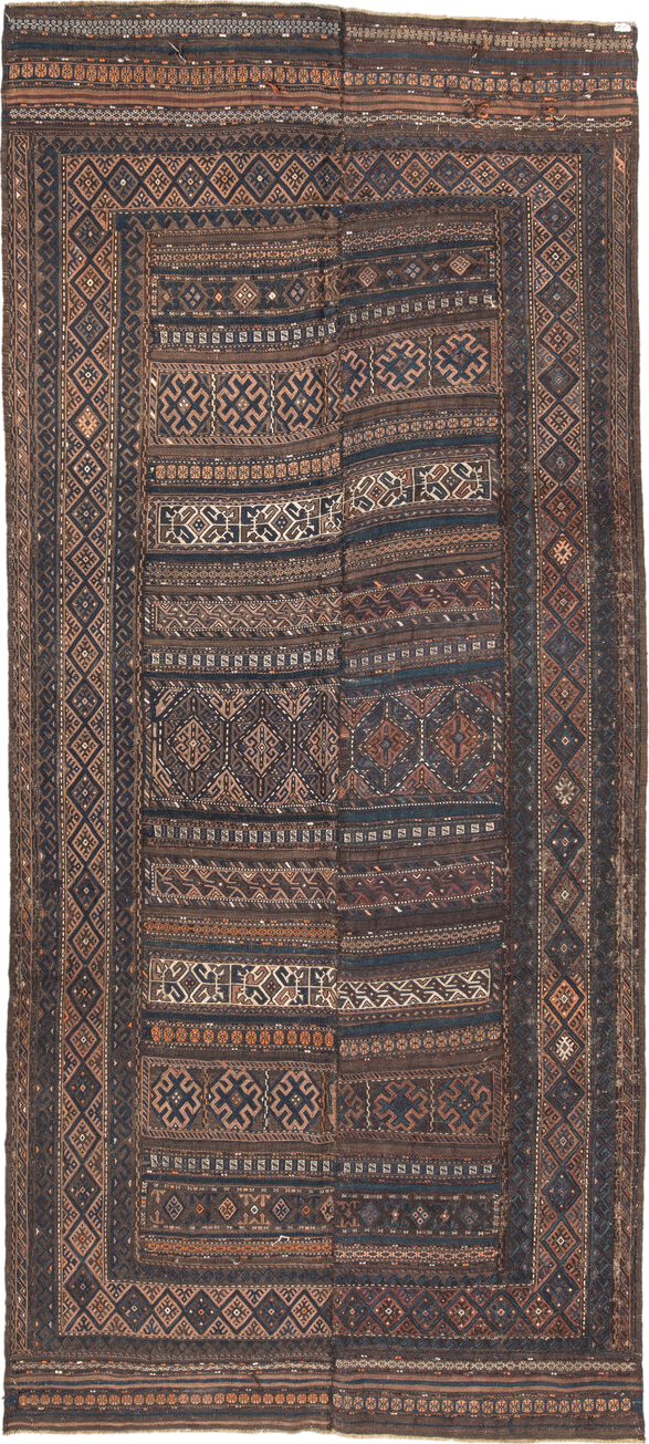 5' x 11' one-of-a-kind handmade vintage Kilim rug. Color palette: brown, indigo, rust, camel, ivory, charcoal, purple