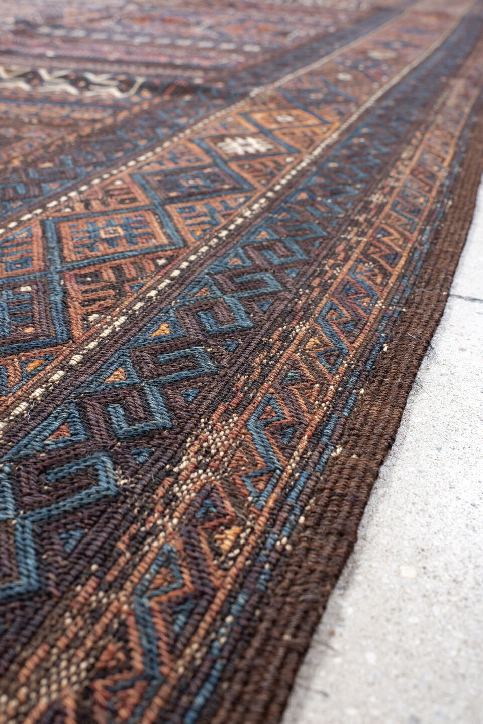5' x 11' one-of-a-kind handmade vintage Kilim rug. Color palette: brown, indigo, rust, camel, ivory, charcoal, purple