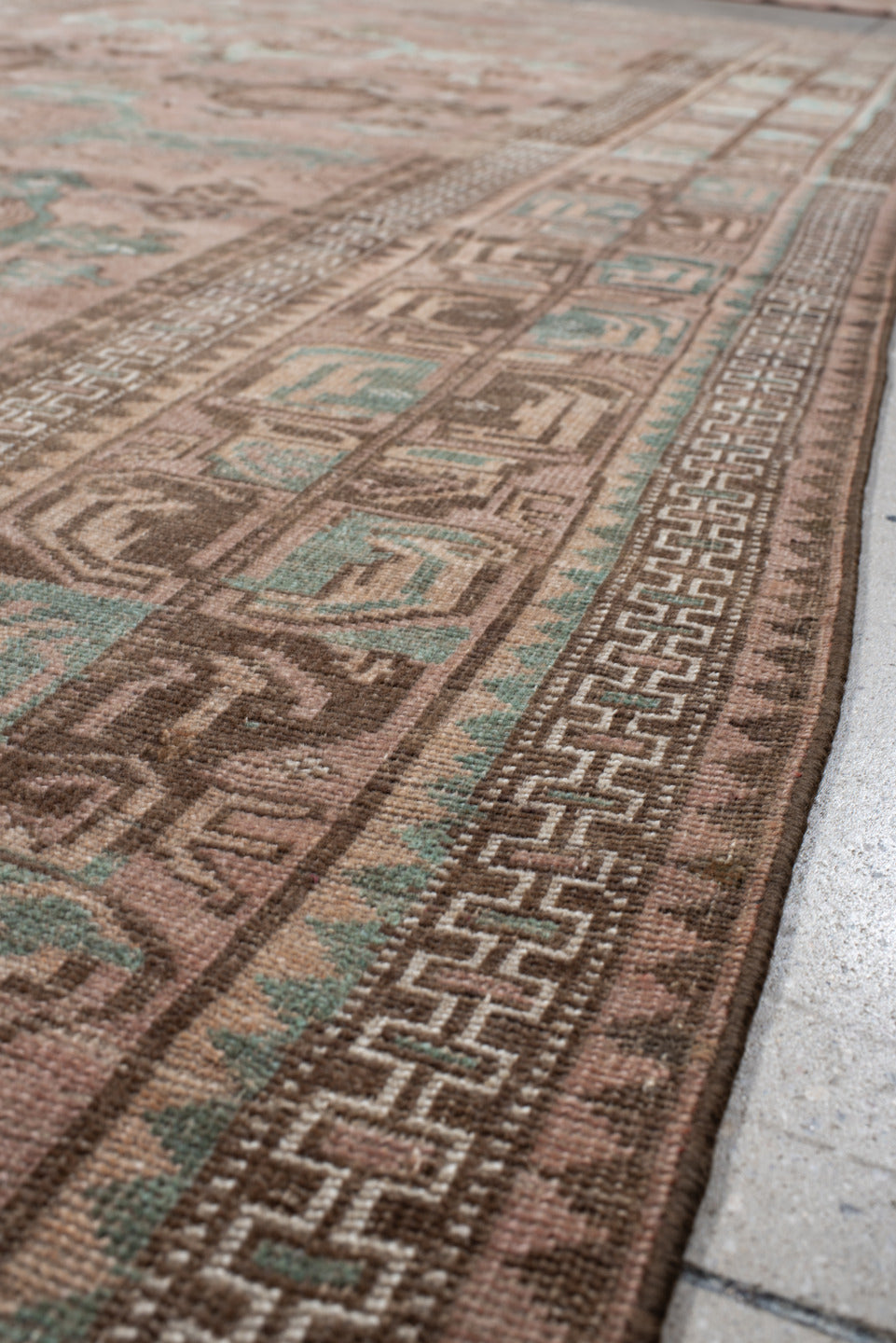 6' x 10' one-of-a-kind handmade vintage Belouch large size rug. Color palette: gray, light gray, brown, off-white, pink