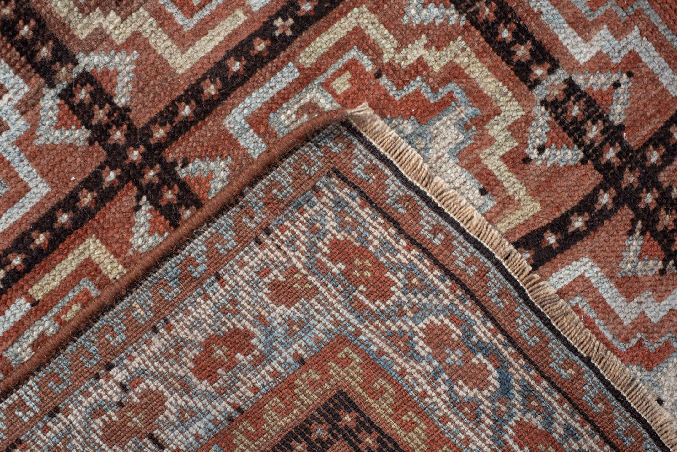 3' x 7' one-of-a-kind handmade vintage Kurd rug. Color palette: rust, ivory, light blue, charcoal, terracotta, camel, brown