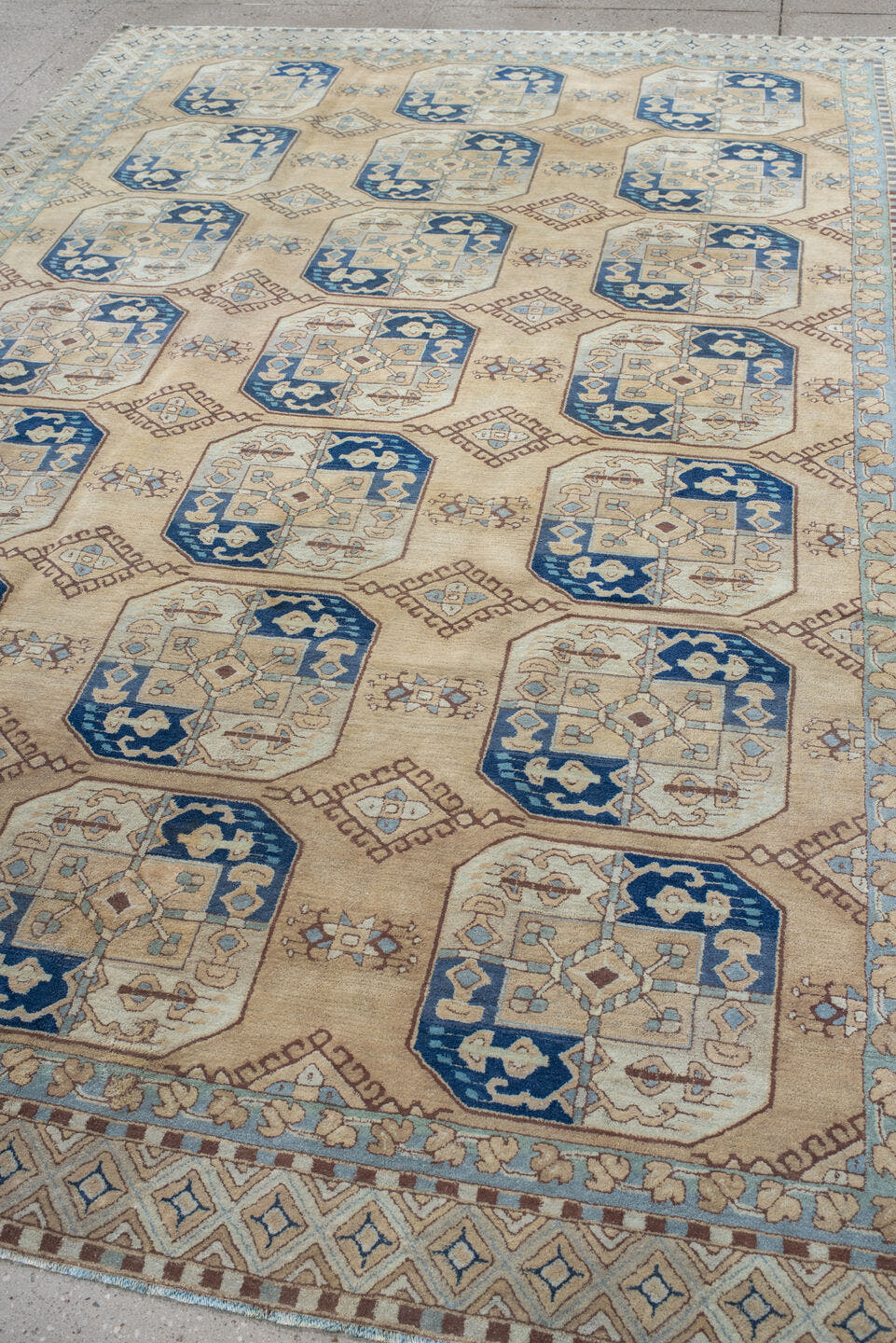 7' x 10' one-of-a-kind handmade vintage Hooked large size rug. Color palette: ivory, sky_blue, navy, tan, camel, taupe