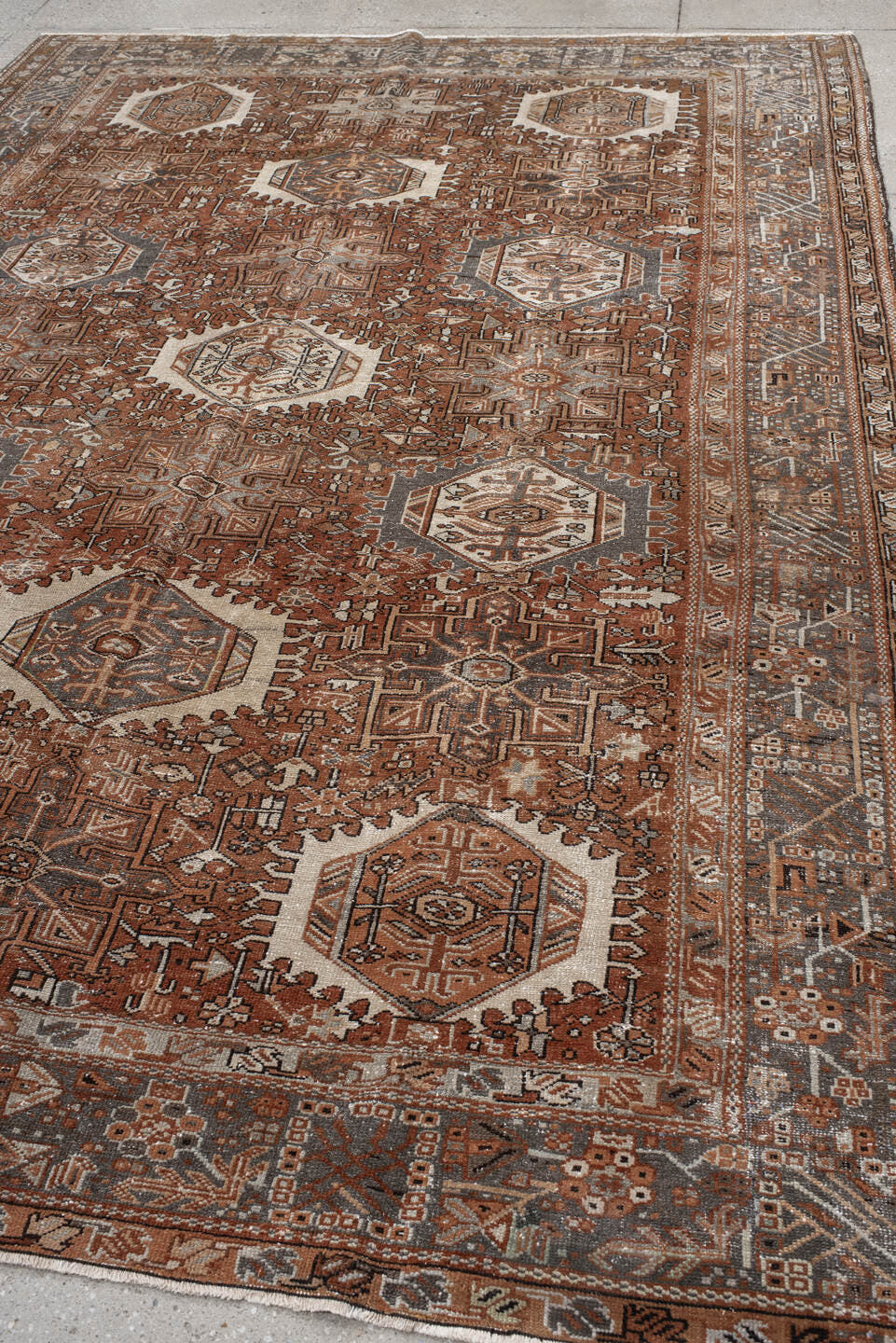 7' x 10' one-of-a-kind handmade vintage Karaje large size rug. Color palette: rust, brown, ivory, slate, taupe, camel