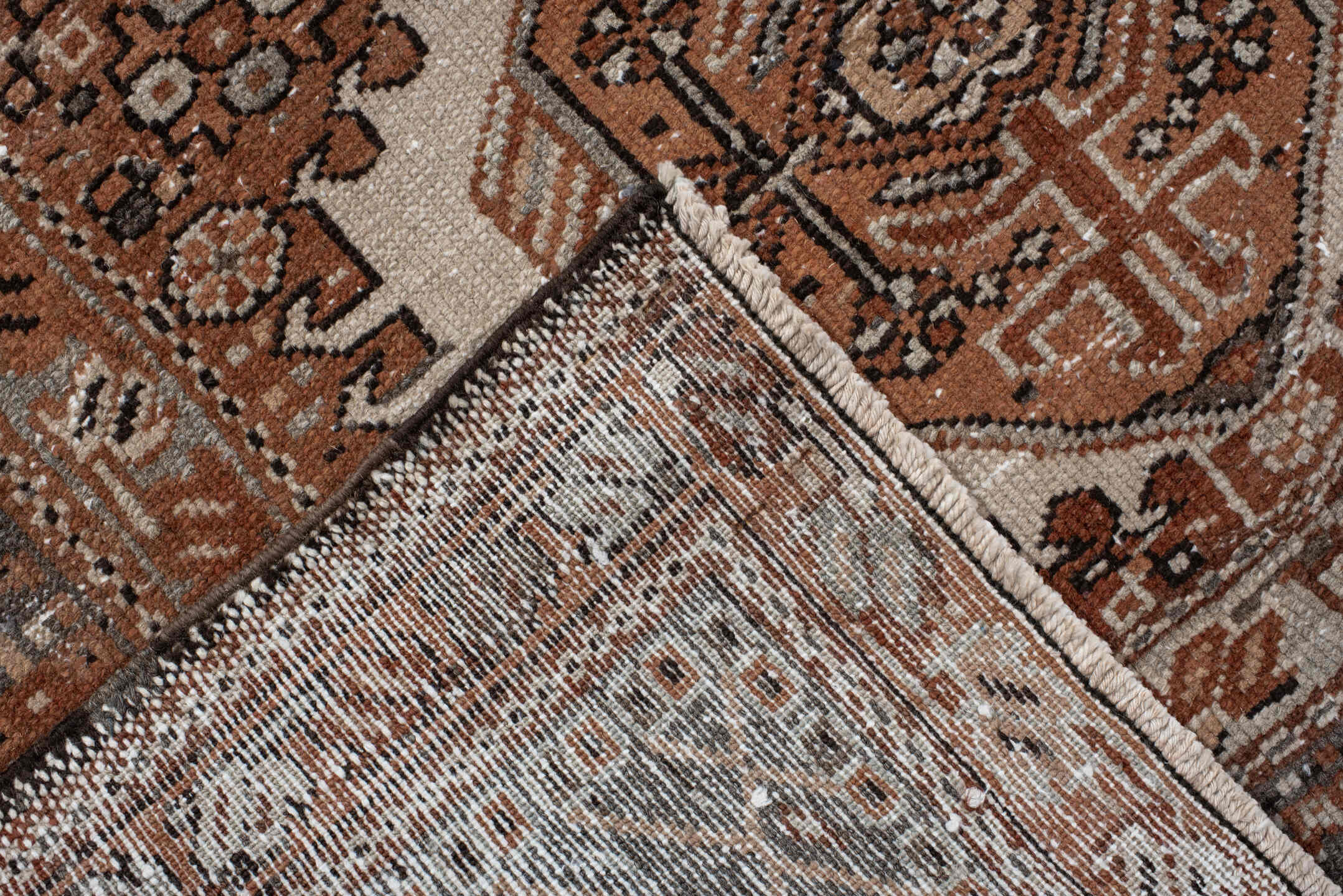 7' x 10' one-of-a-kind handmade vintage Karaje large size rug. Color palette: rust, brown, ivory, slate, taupe, camel