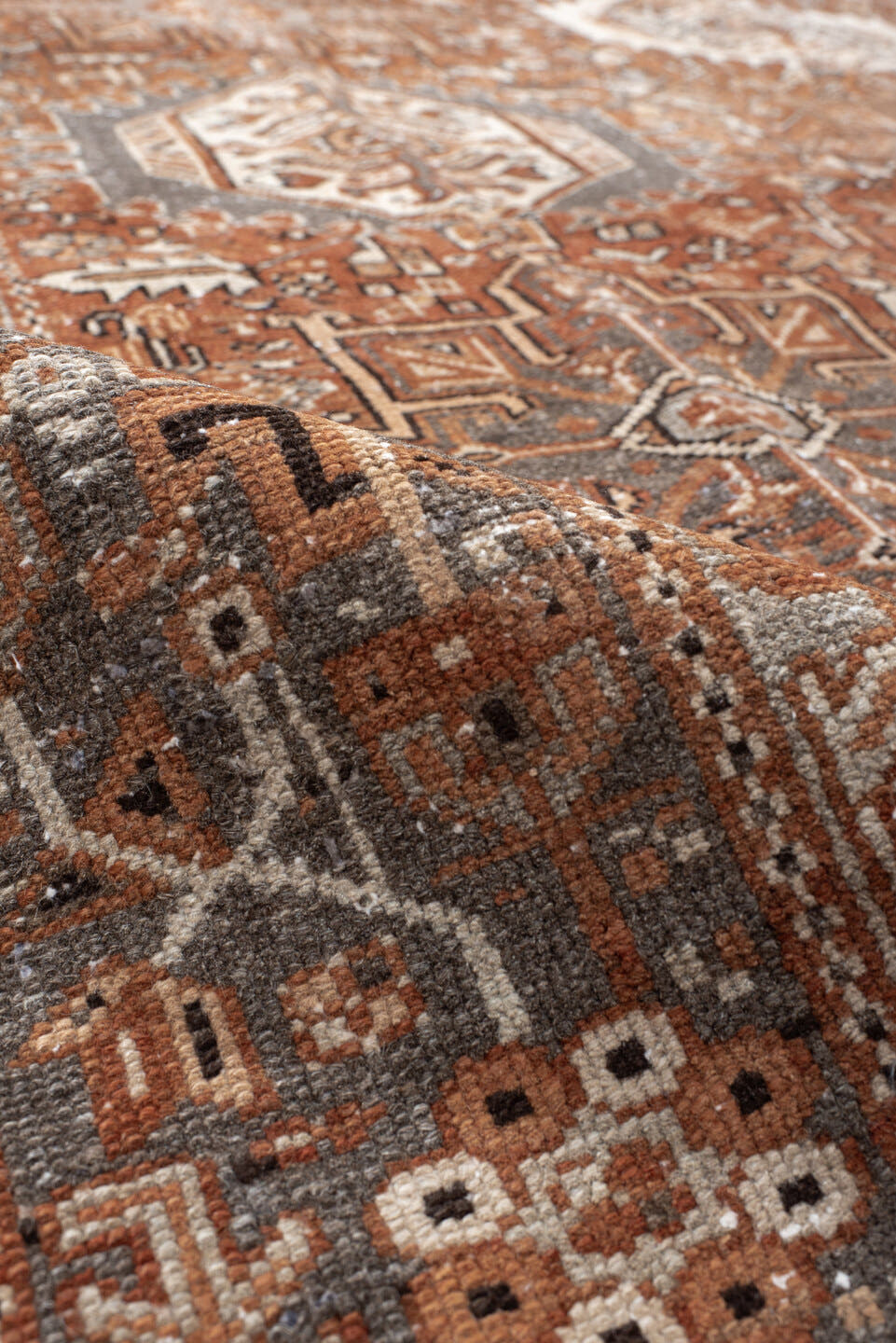 7' x 10' one-of-a-kind handmade vintage Karaje large size rug. Color palette: rust, brown, ivory, slate, taupe, camel