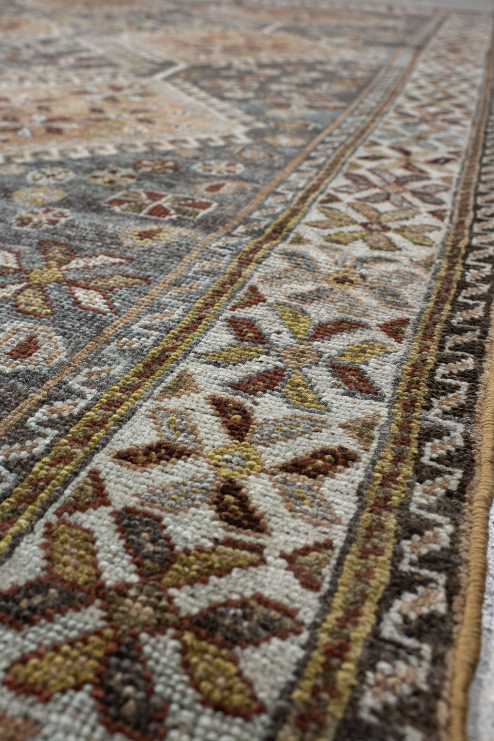 4' x 8' one-of-a-kind handmade vintage Shiraz rug. Color palette: slate, ivory, camel, taupe, rust, charcoal, sage, gold