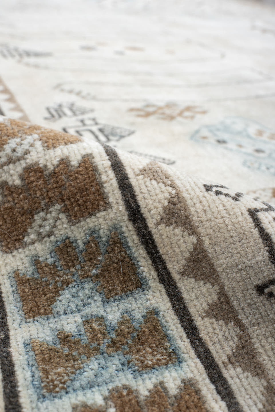4' x 6' one-of-a-kind handmade vintage Gabbe small size rug. Color palette: ivory, camel, sky blue, brown, taupe, charcoal