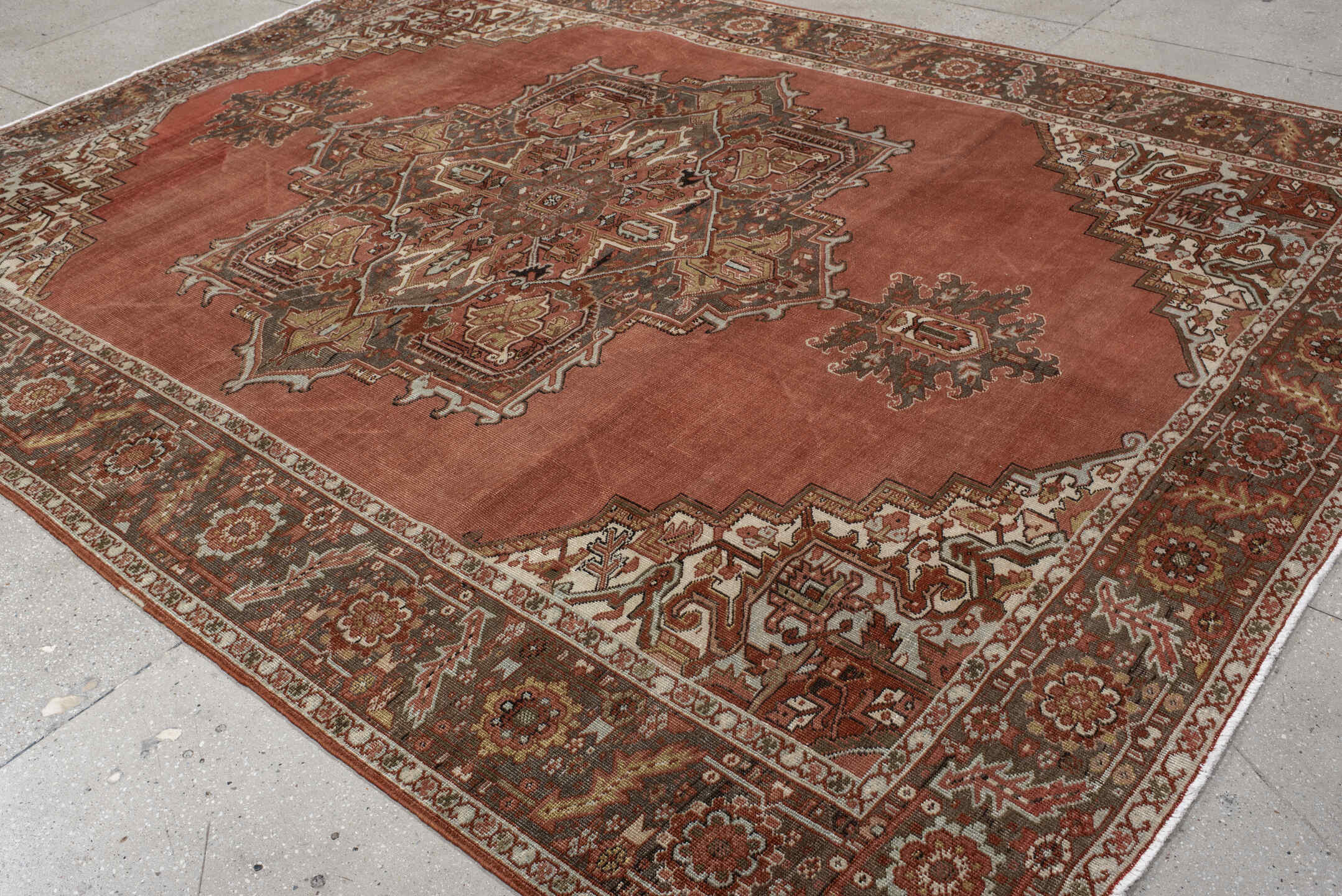 8' x 11' one-of-a-kind handmade antique Heriz large size rug. Color palette: terra cotta, ivory, charcoal, rust, sage, taupe