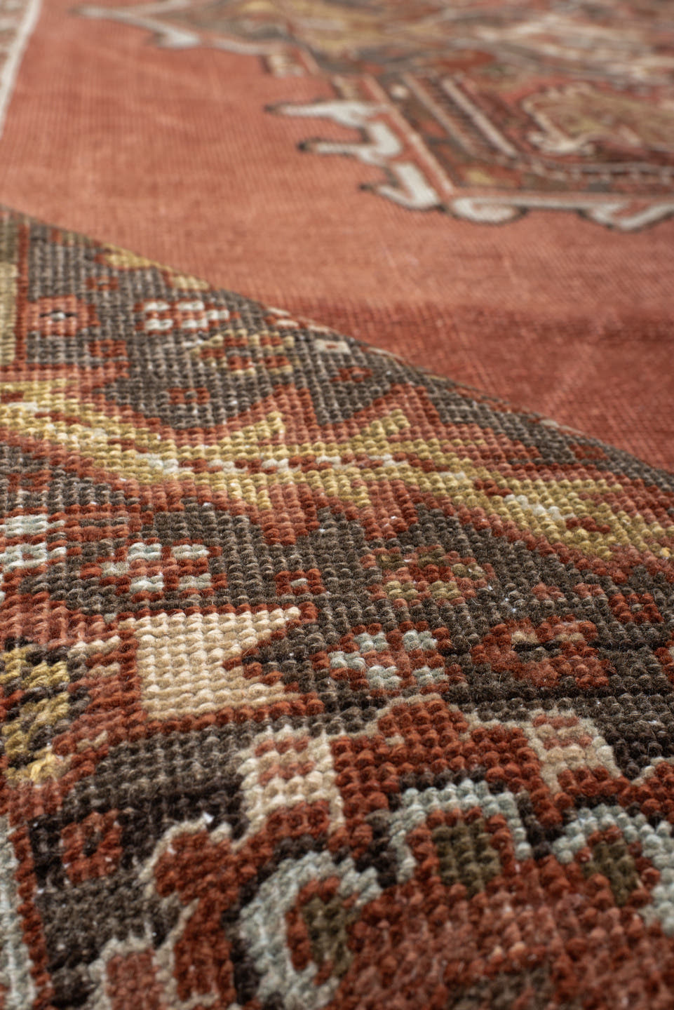 8' x 11' one-of-a-kind handmade antique Heriz large size rug. Color palette: terra cotta, ivory, charcoal, rust, sage, taupe