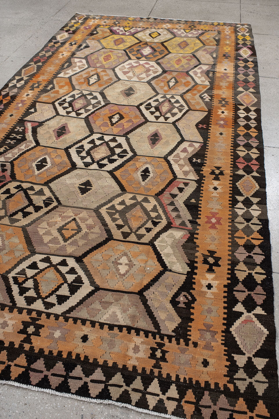 6' x 12' one-of-a-kind handmade antique Kilim large size rug. Color palette: camel, brown, taupe, ochre, ivory, plum