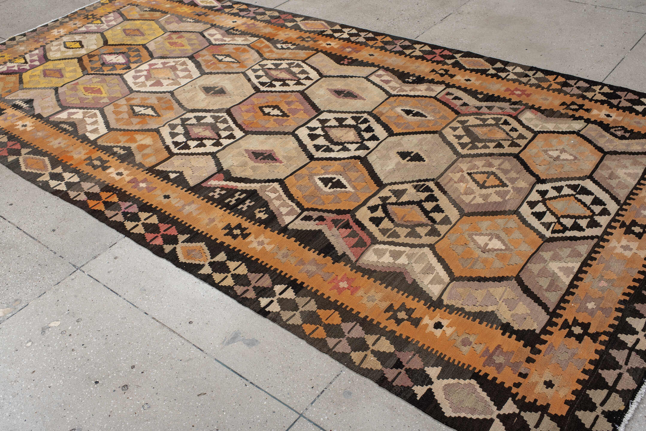 6' x 12' one-of-a-kind handmade antique Kilim large size rug. Color palette: camel, brown, taupe, ochre, ivory, plum